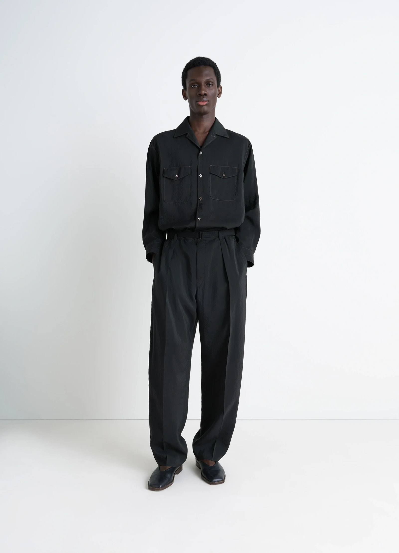 Lemaire convertible collar shirt in black dry silk blend, model shot, full body view buttoned cuffs, chest pockets