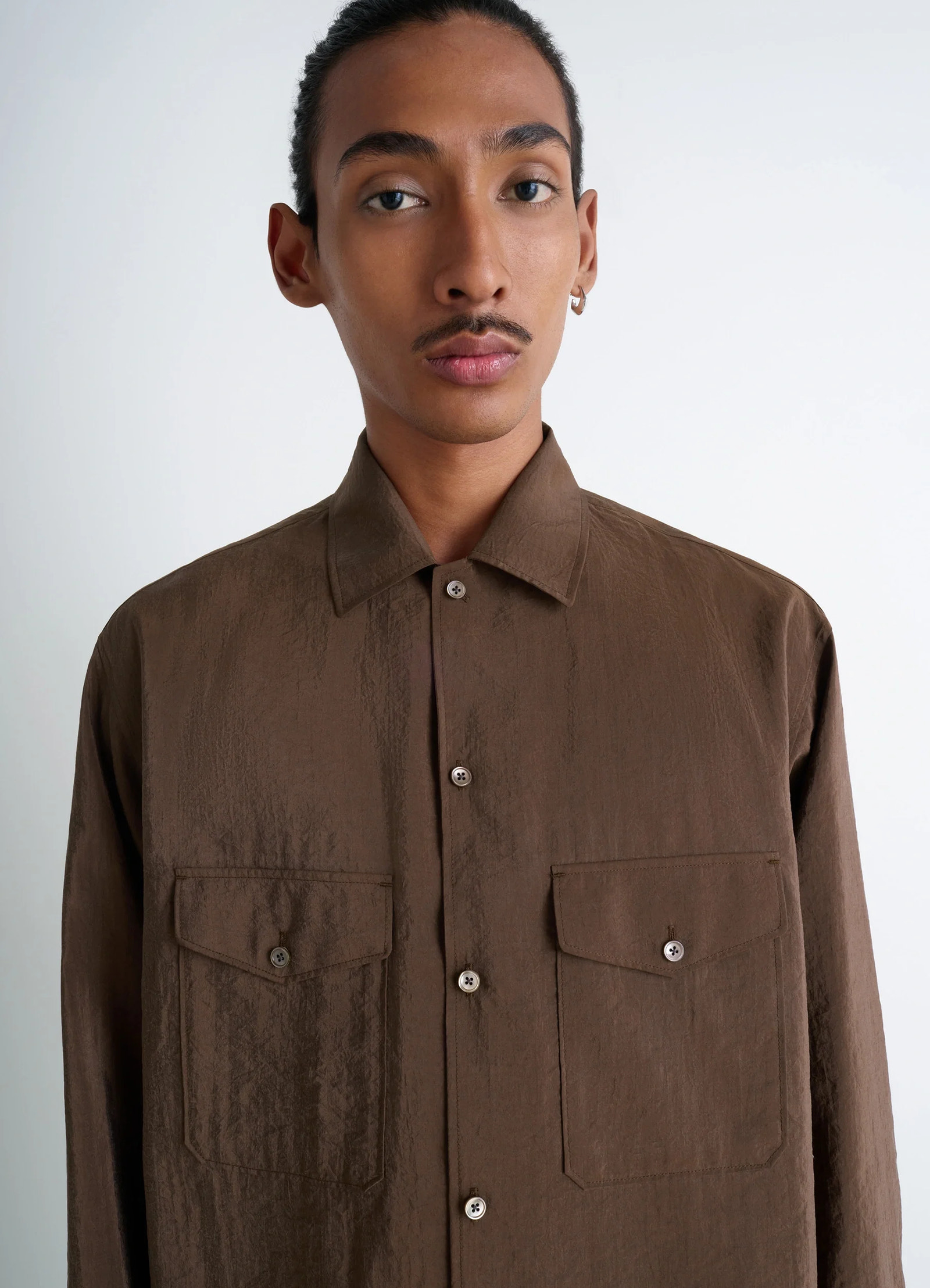 Lemaire convertible collar shirt in brown dry silk blend, model shot, close-up view dual chest pockets view 3