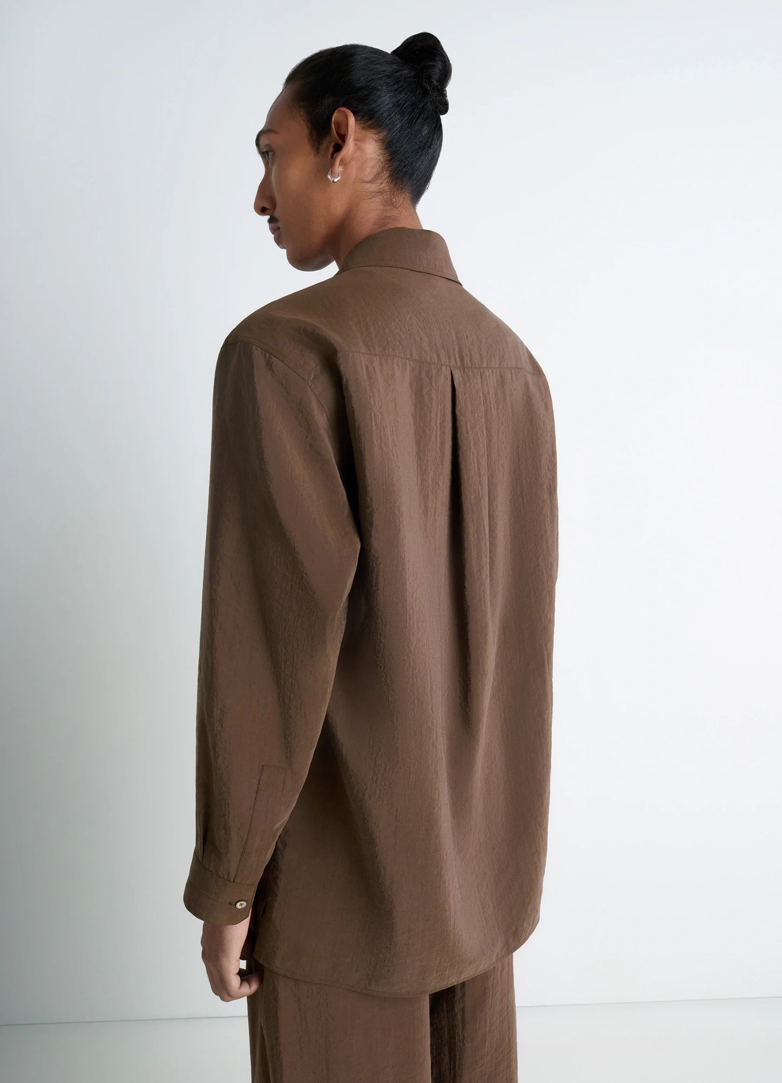 Lemaire convertible collar shirt in brown dry silk blend, model shot, back view single button cuffs