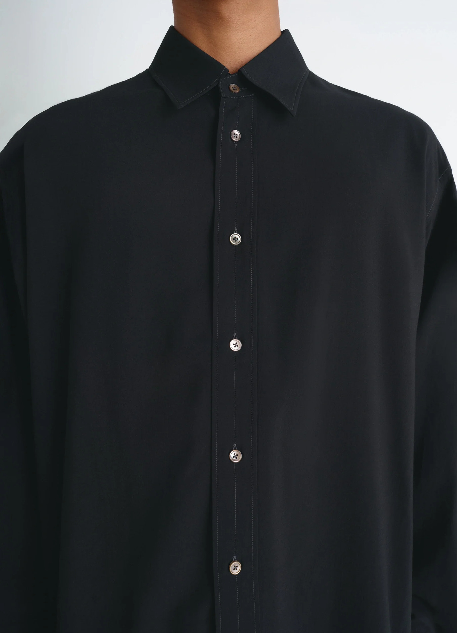 Lemaire relaxed shirt in dark viscose wool blend, model shot, close-up front button placket details