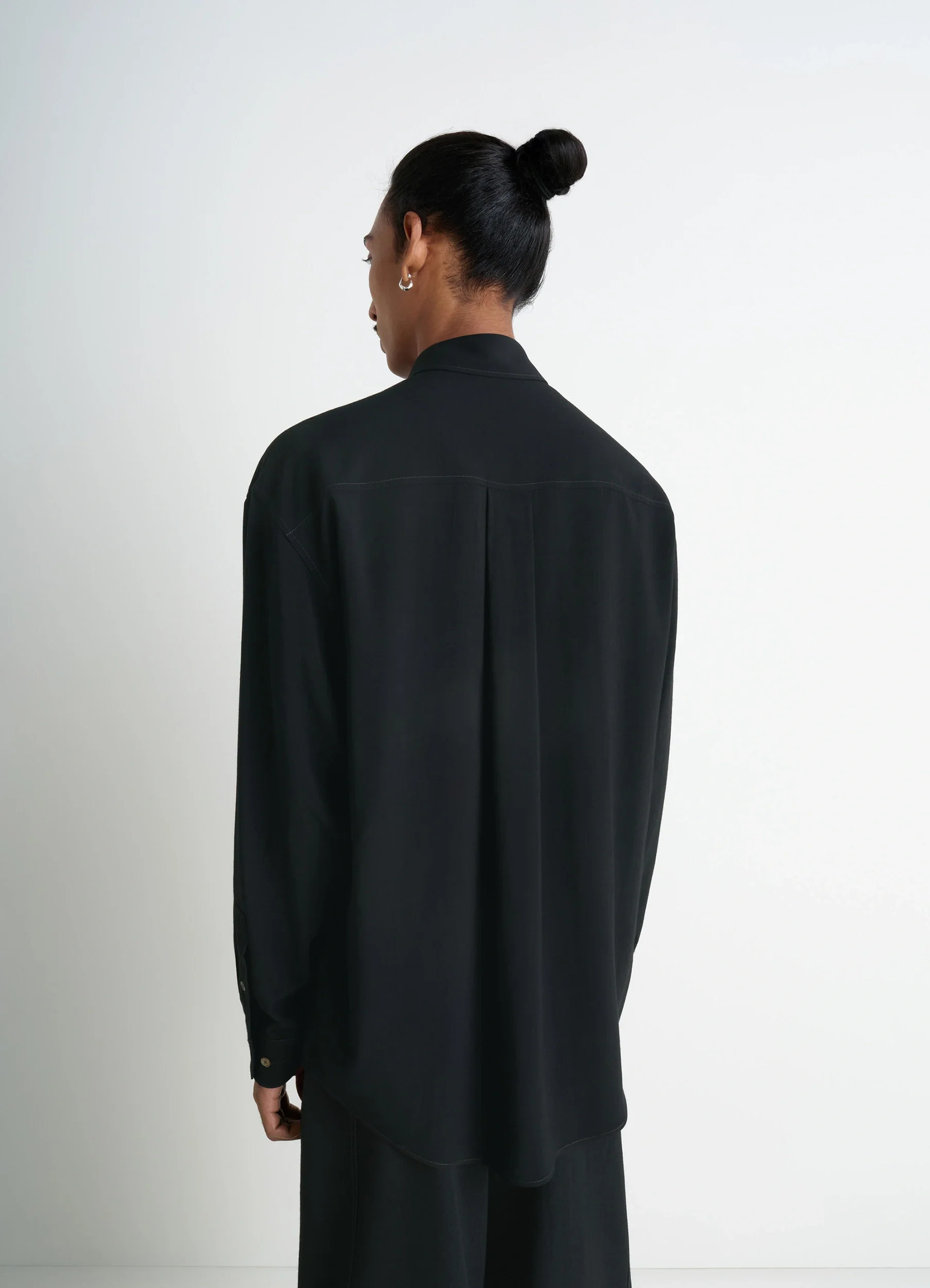 Lemaire relaxed shirt in dark viscose wool blend, model shot, back view pleated back drape