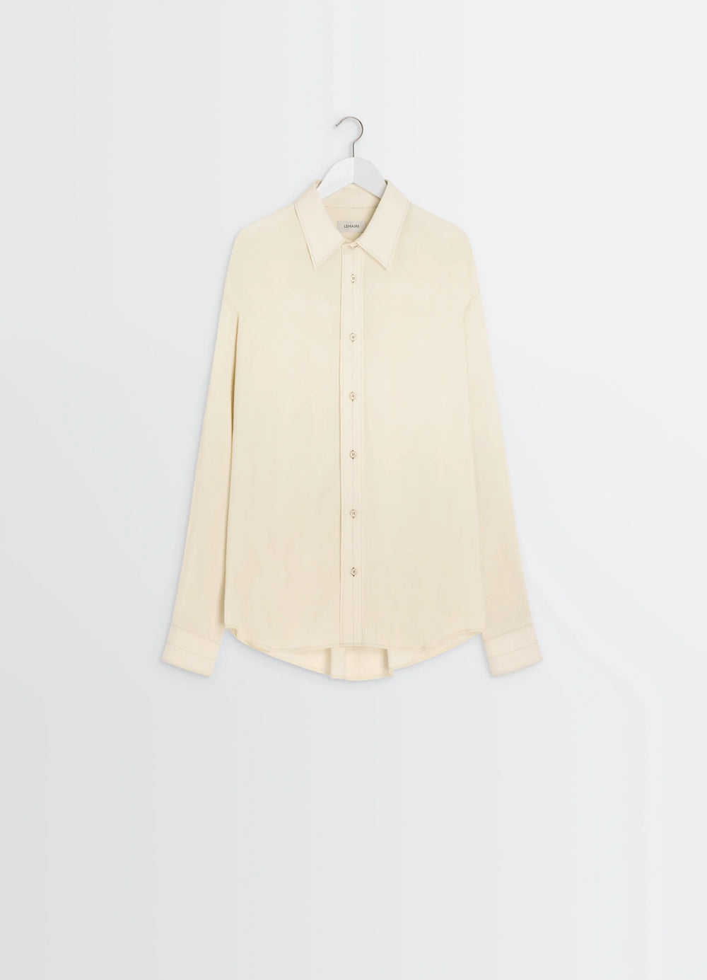 Lemaire Relaxed Shirt in Light Viscose Wool Blend, product shot, hanger view curved hem, buttoned cuffs