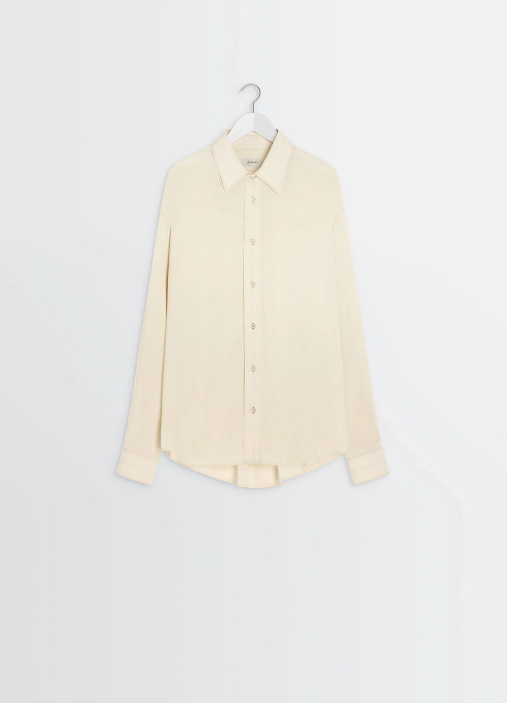 Lemaire Relaxed Shirt in Light Viscose Wool Blend, product shot, hanger view curved hem, buttoned cuffs
