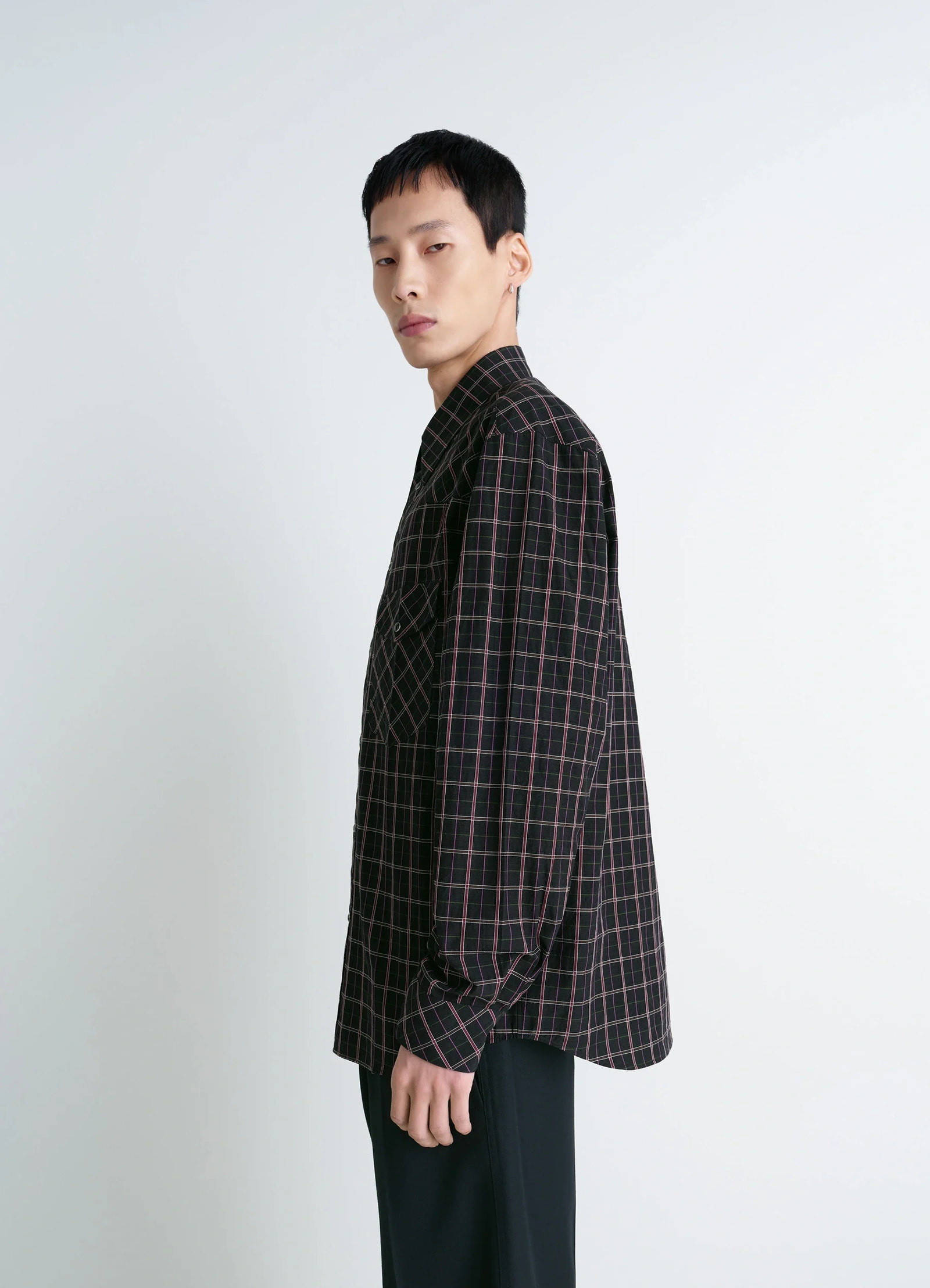Western check shirt in textured cotton plaid, model shot, three-quarter view buttoned collar, loose drape