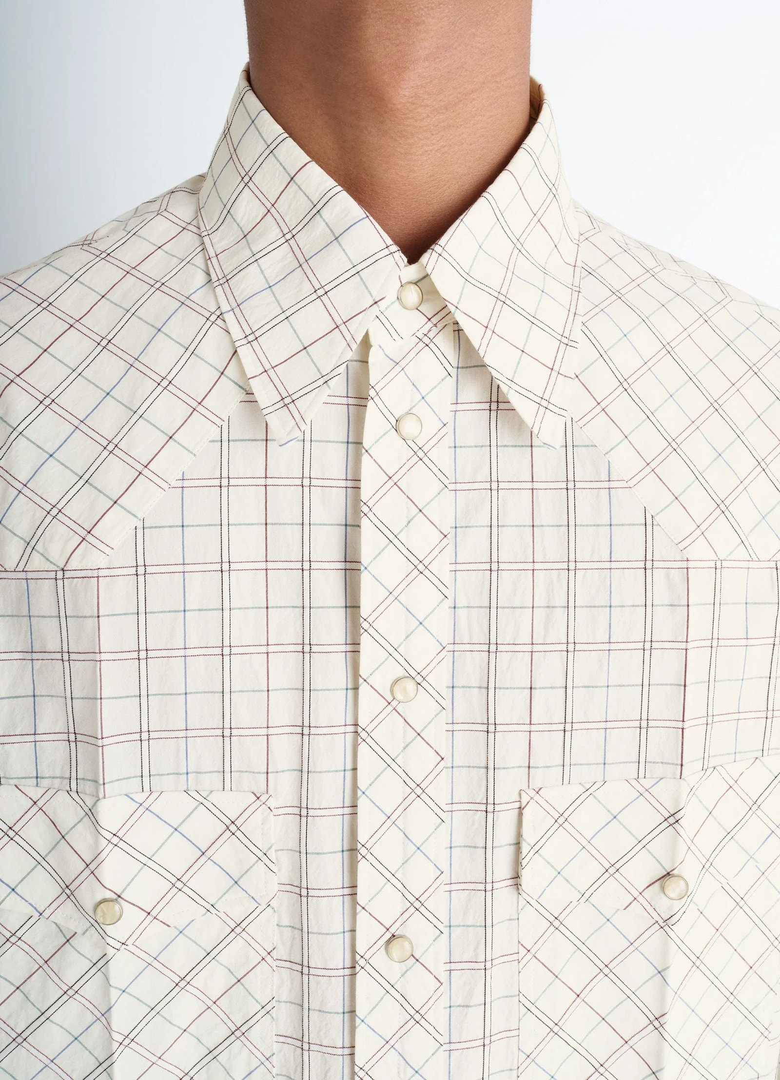Western check shirt in textured cotton plaid, model shot, close-up front detail check pattern with buttons