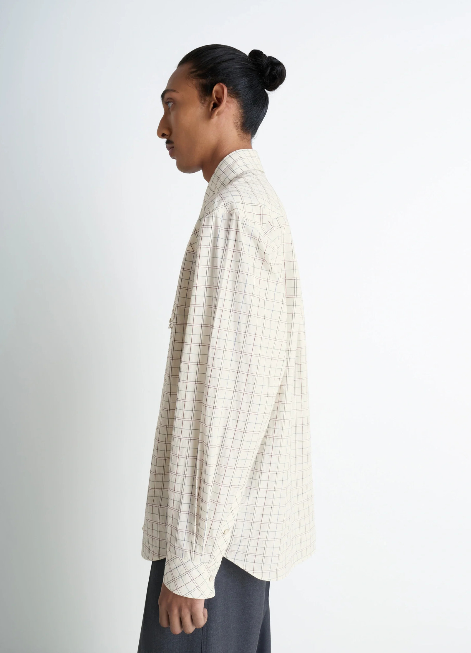 Western check shirt in textured cotton plaid, model shot, side view long sleeves with placket