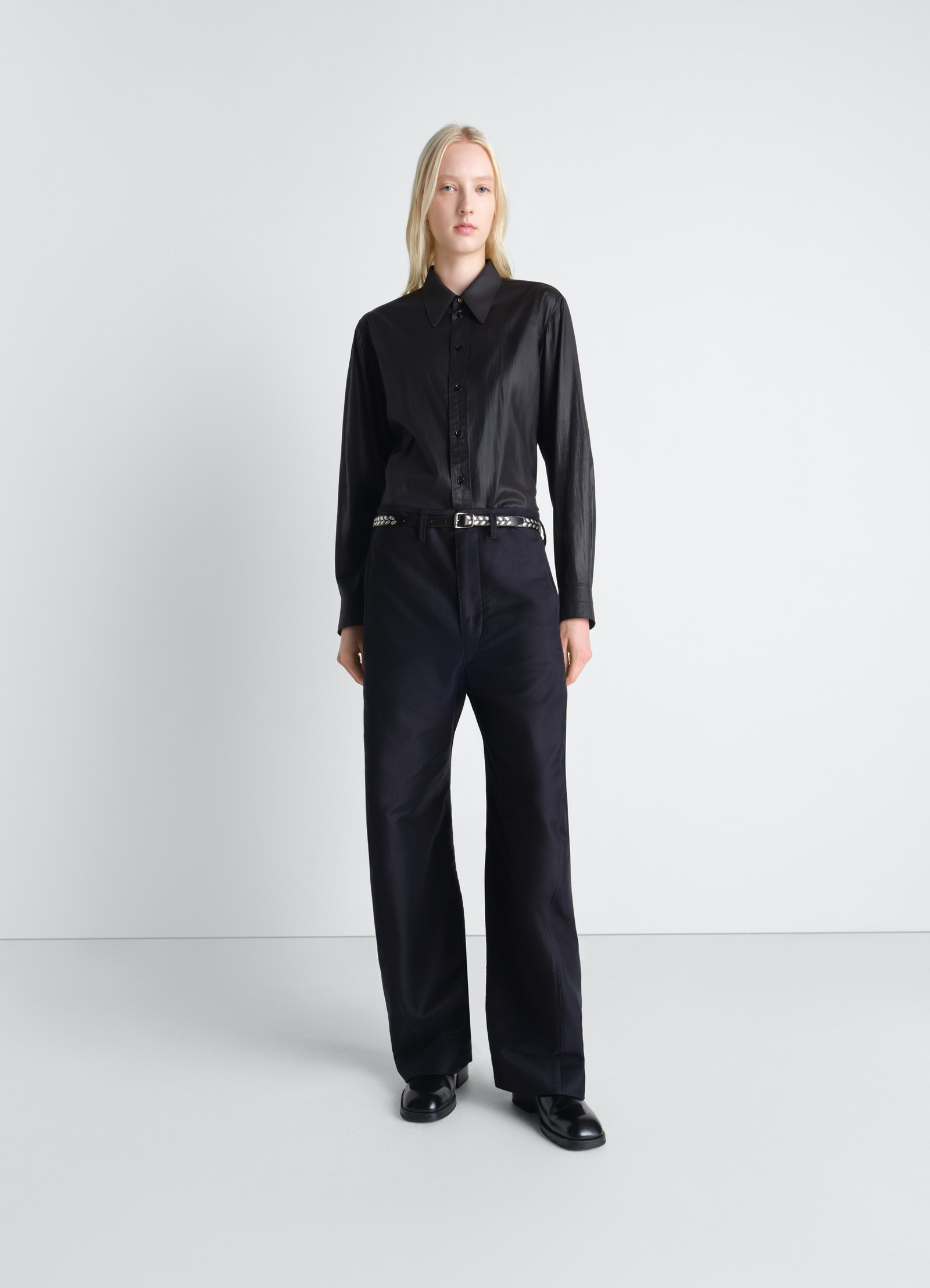 Pointed collar surrealist shirt in chintzed toile, model shot, three-quarter view long sleeves draped look