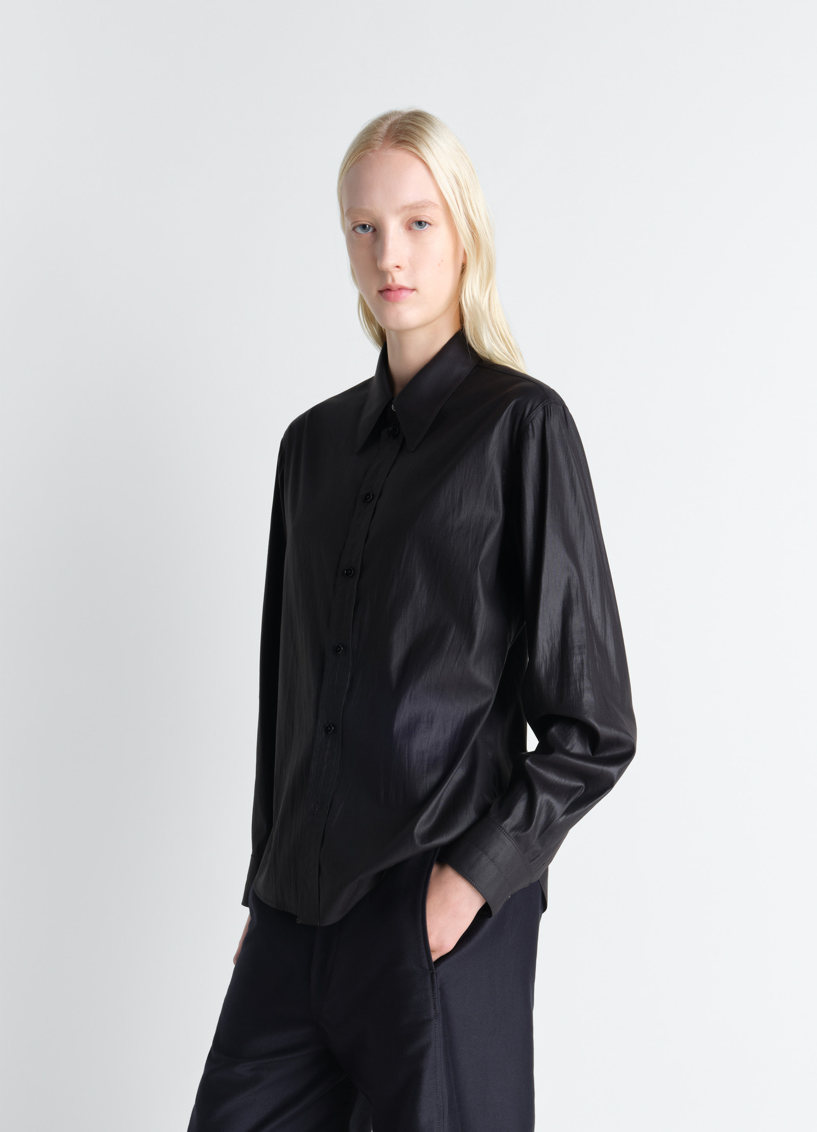 Pointed collar surrealist shirt in chintzed toile, model shot, side profile view button-up sheen shirt