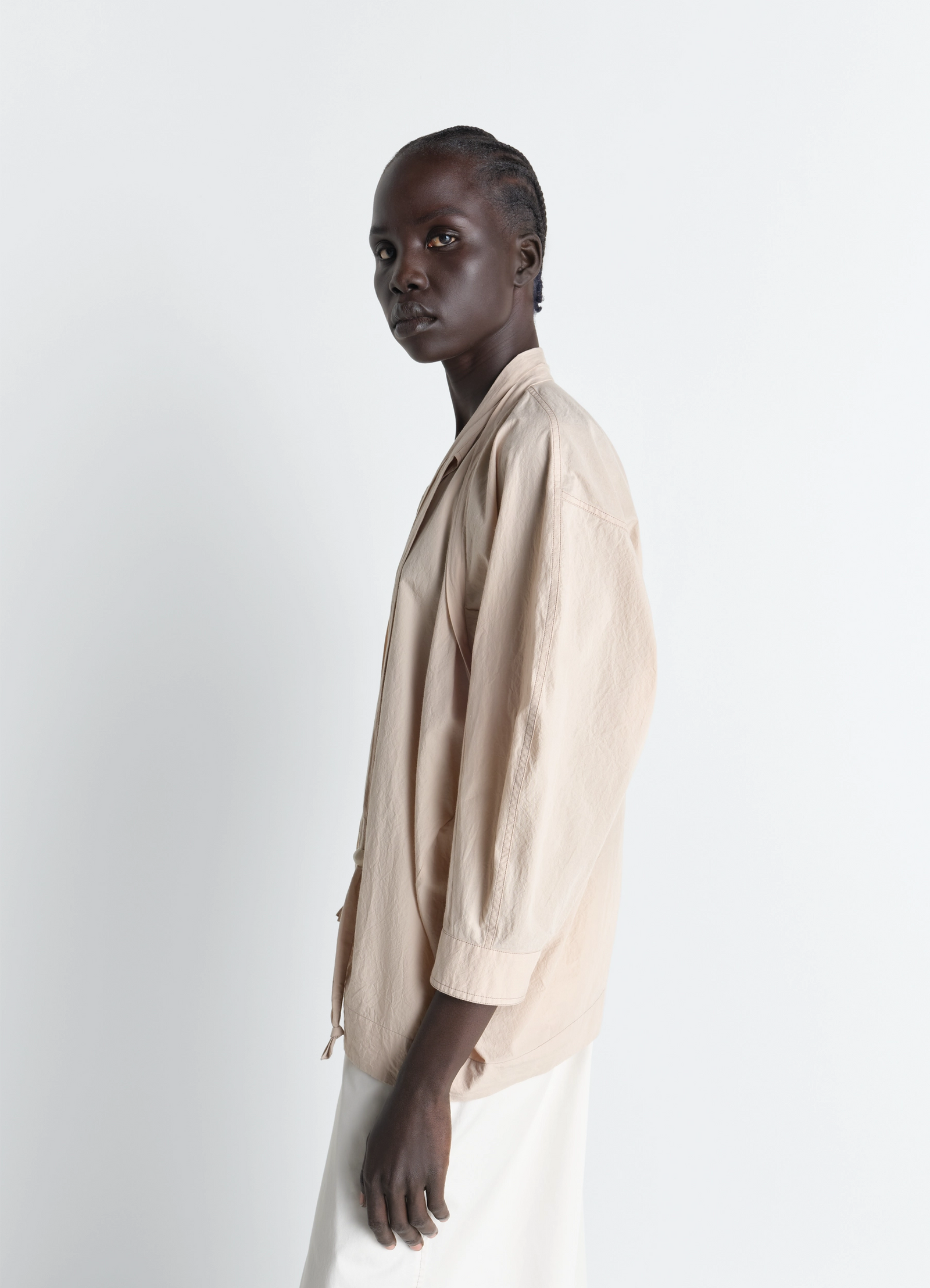 Lemaire blouse with scarf in crepe cotton, model shot, three-quarter back view draped back hem