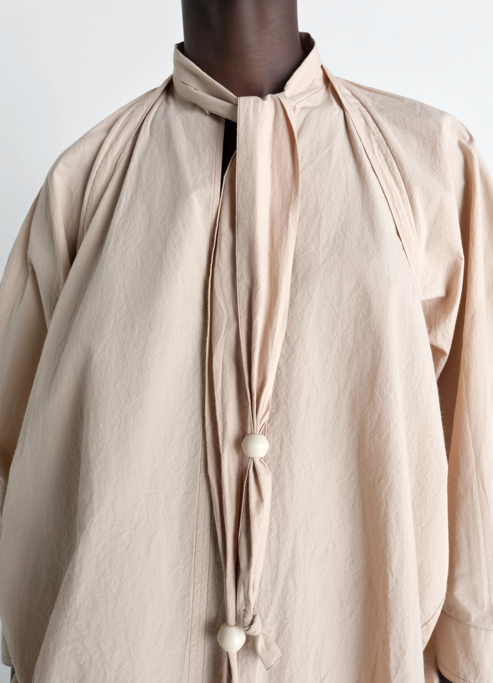 Lemaire blouse with scarf in crepe cotton, model shot, close-up detailed shot textured fabric buttons