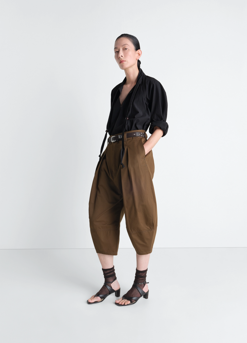 Lemaire Blouse with Scarf in Crepe Cotton Black, model shot, three-quarter view relaxed fit sleeves
