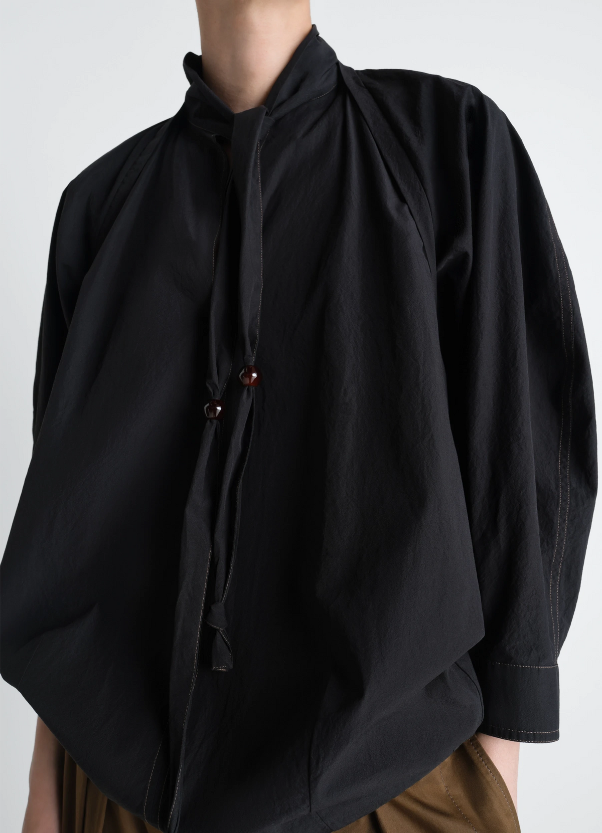 Lemaire Blouse with Scarf in Crepe Cotton Black, model shot, Front side view Integrated scarf detail