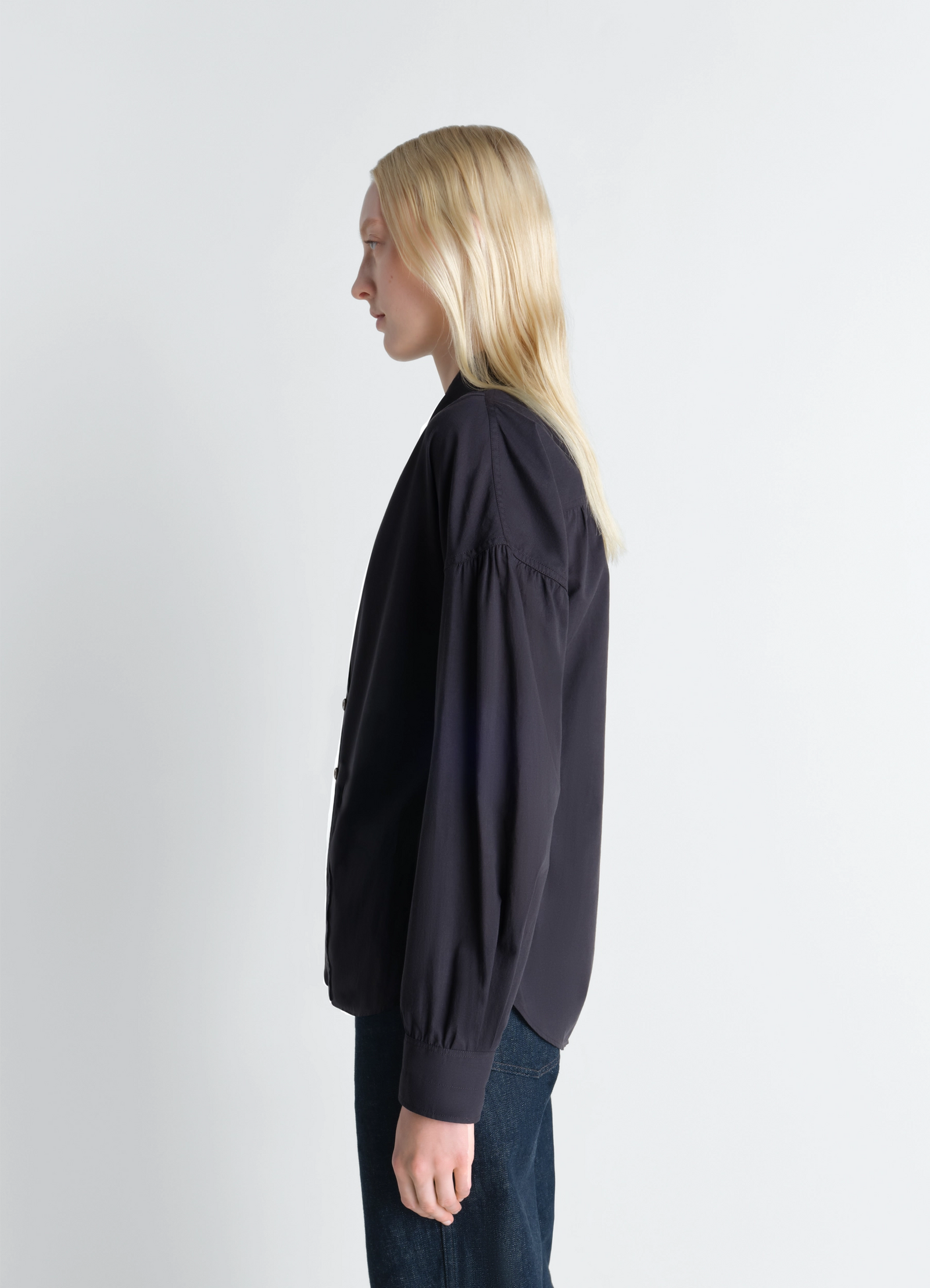 Lemaire soft pointed collar shirt in washed cotton muslin, model shot, three-quarter view gathered sleeve design