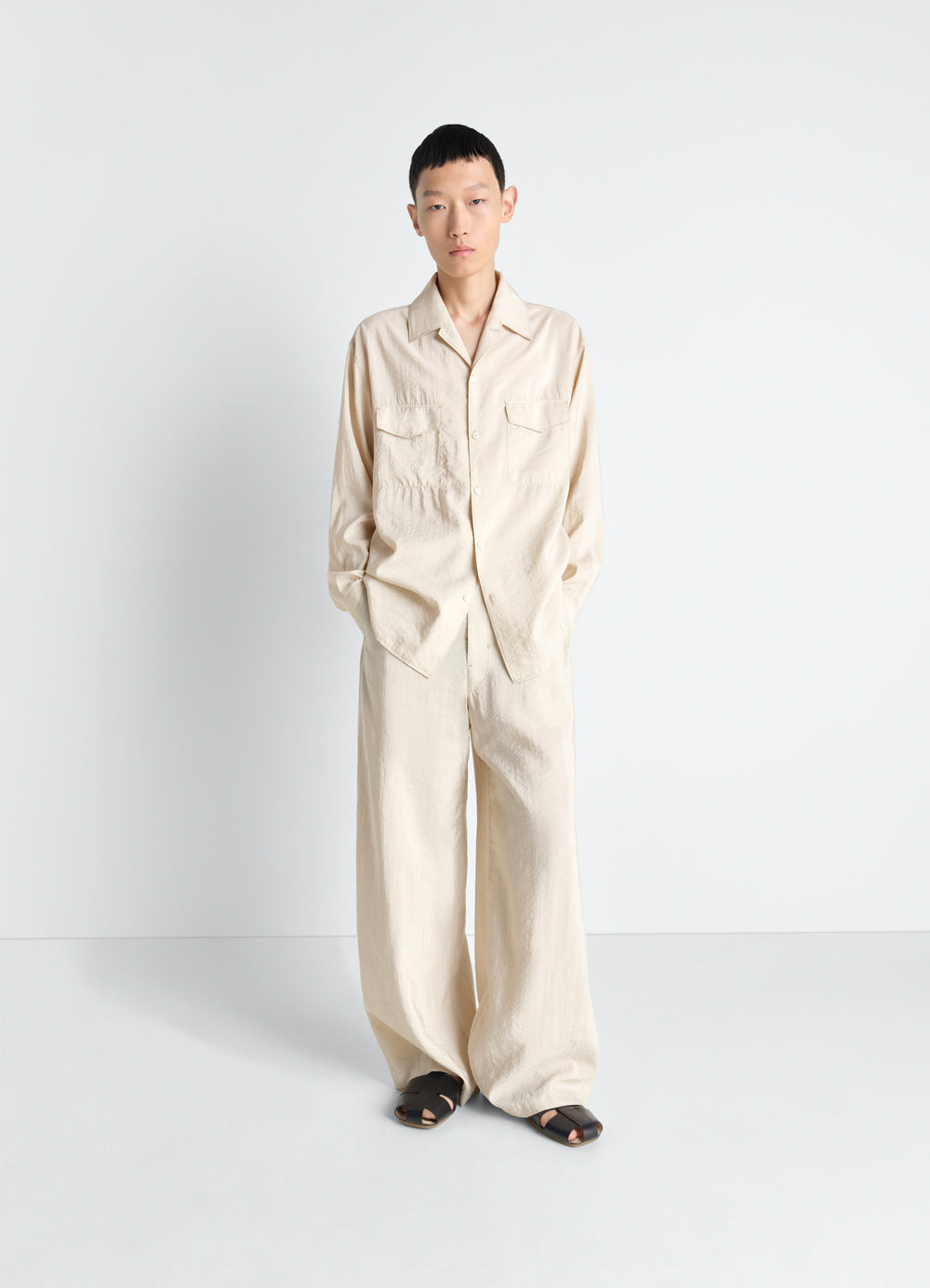 Lemaire Convertible Collar Shirt in Dry Silk Blend, model shot, full body front view relaxed fit with pockets