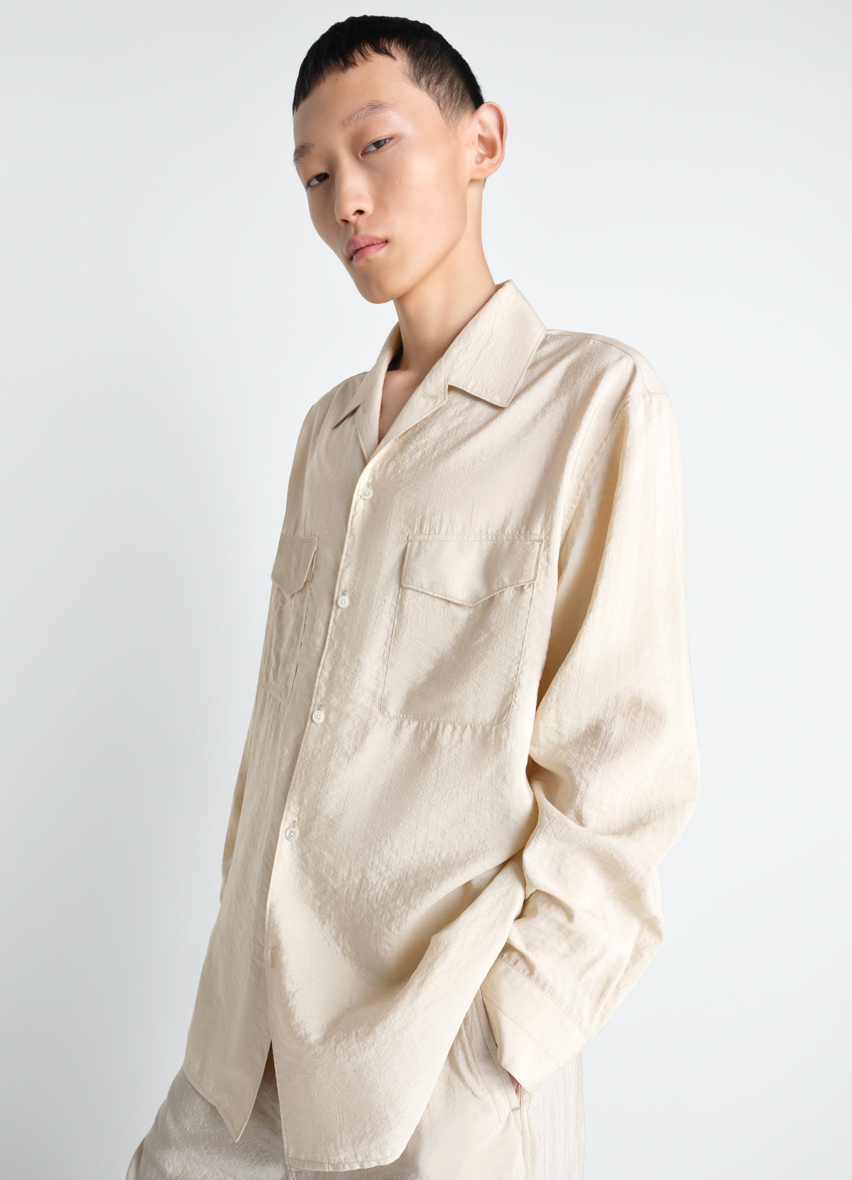 Lemaire Convertible Collar Shirt in Dry Silk Blend, model shot, Front view Loose fit, button detail