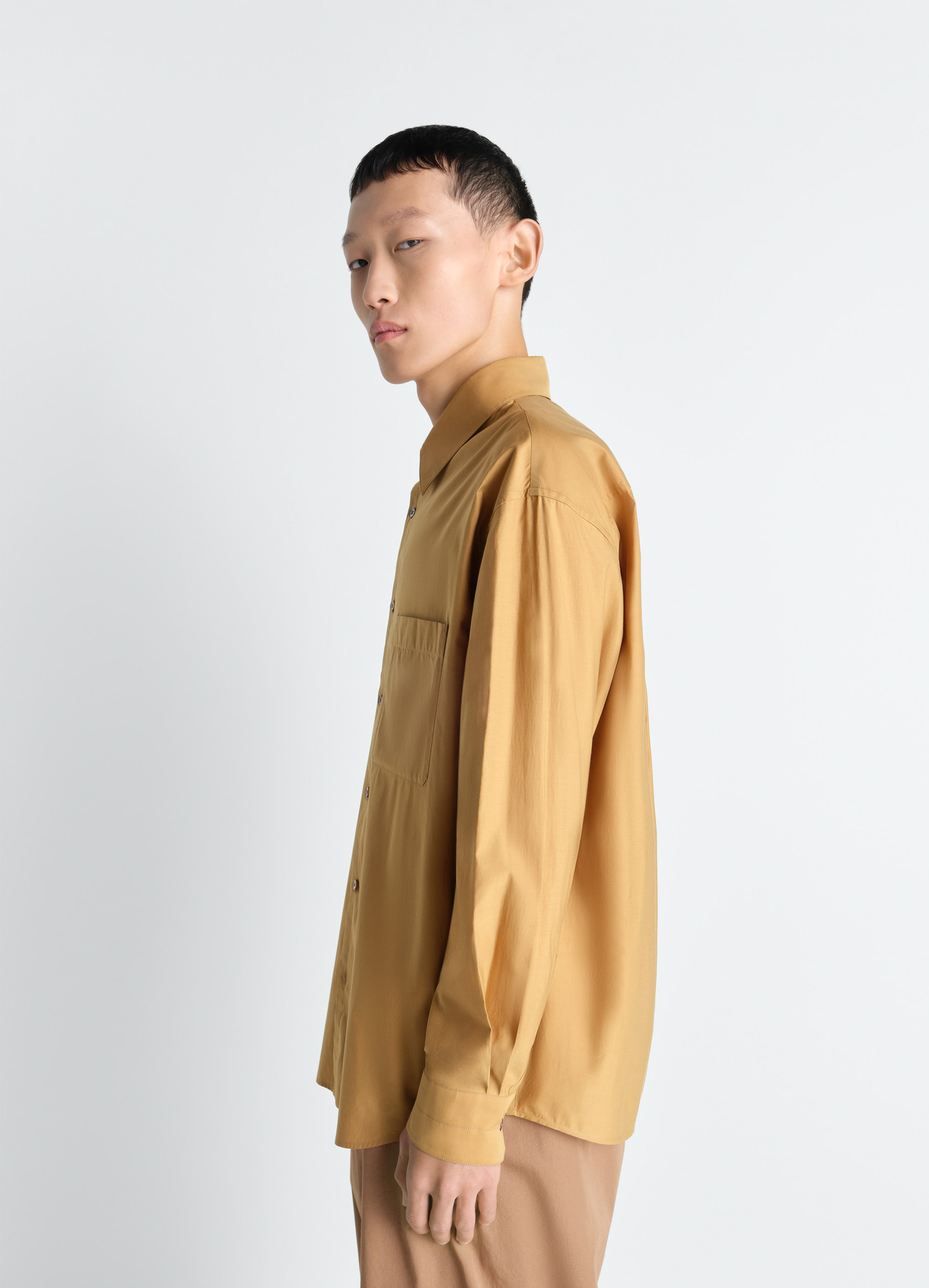 Lemaire regular shirt in washed cotton silk, model shot, side view long sleeves, single pocket