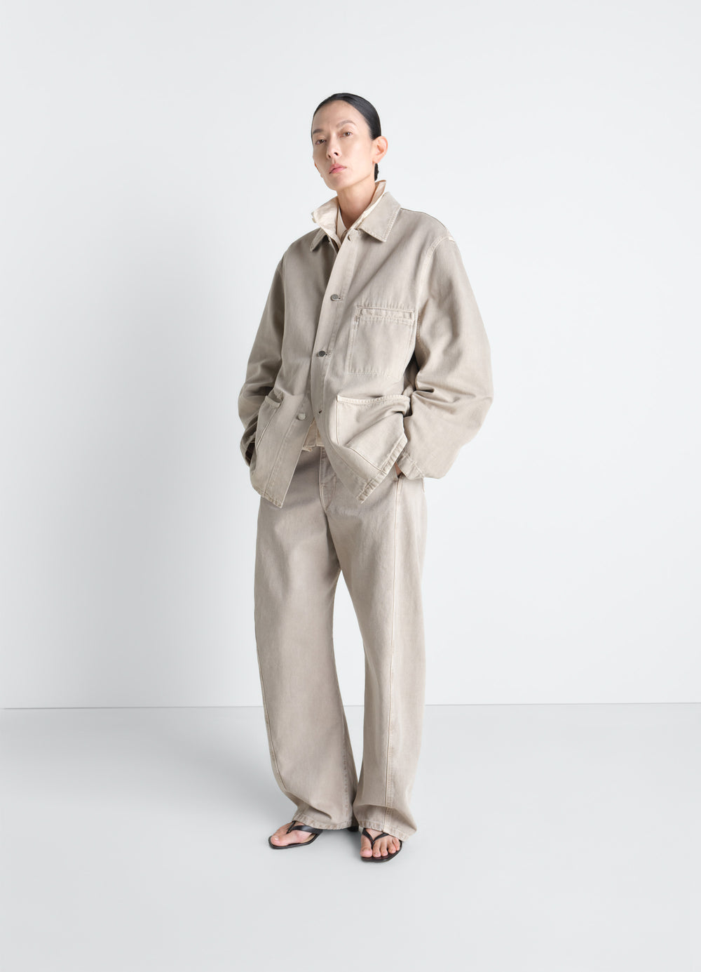 Utility Overshirt in Snow Broken Twill, model shot, three-quarter view buttoned cuffs