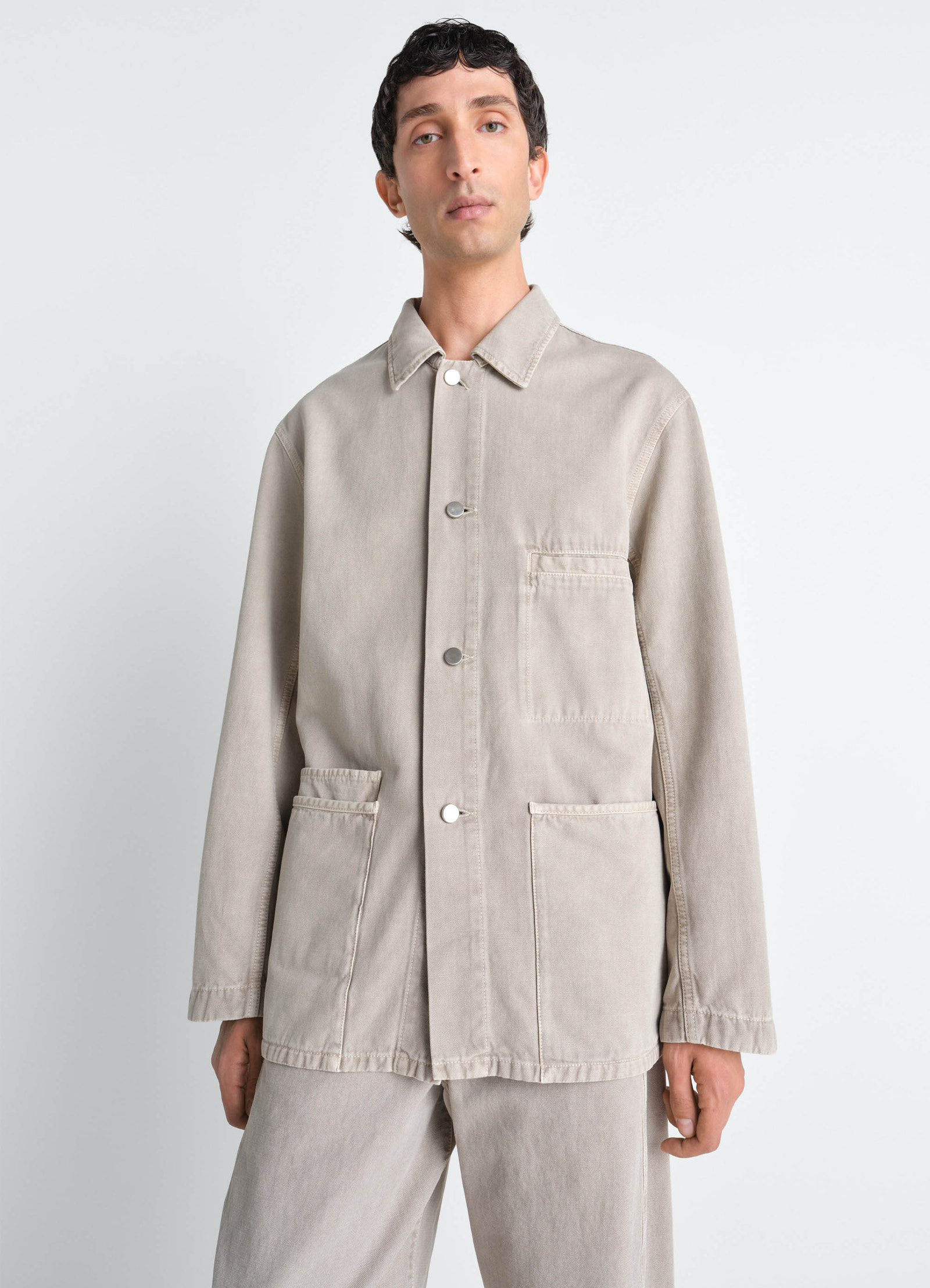 Utility overshirt in snow broken twill, model shot, upper body view long sleeves, pocket stitch