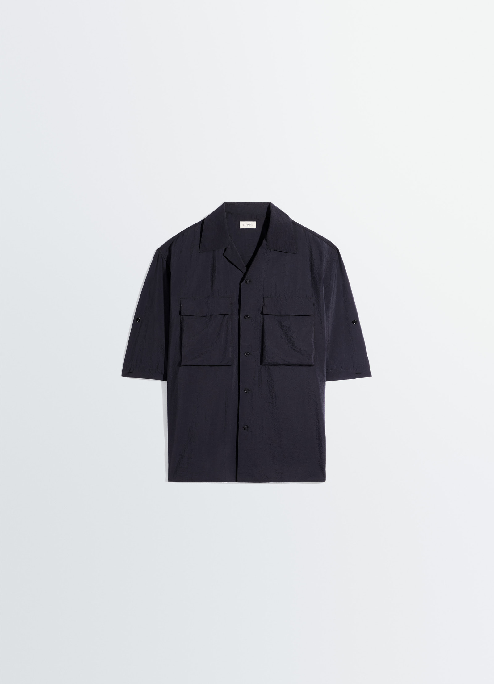 Short sleeve utility shirt in washed technical cotton, product shot, flat lay view minimalist collar design