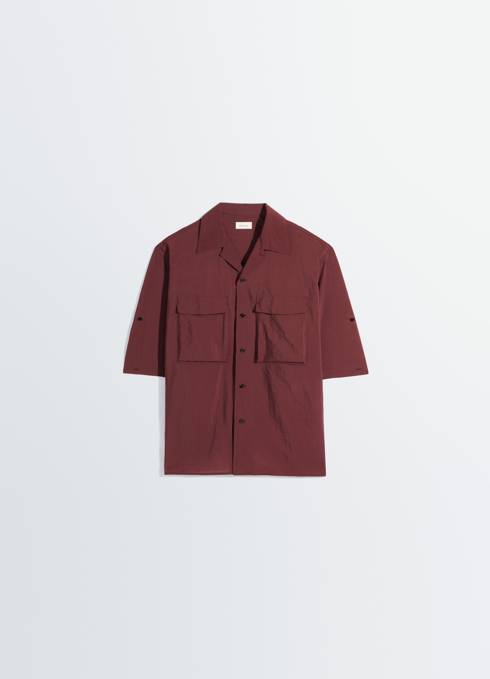 Short sleeve utility shirt in washed technical cotton, product shot, angled front drape boxy fit with patch pockets