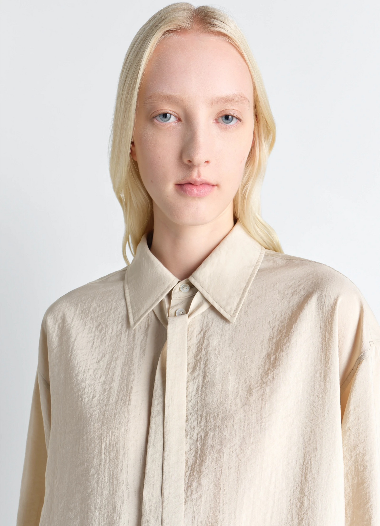 Lemaire long shirt with tie in dry silk, model shot, close-up view necktie collar detail