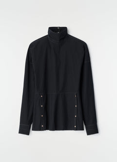 Black cotton crepe press-stud bib top by LEMAIRE with high collar and contrast stitching flat lay, primary product shot