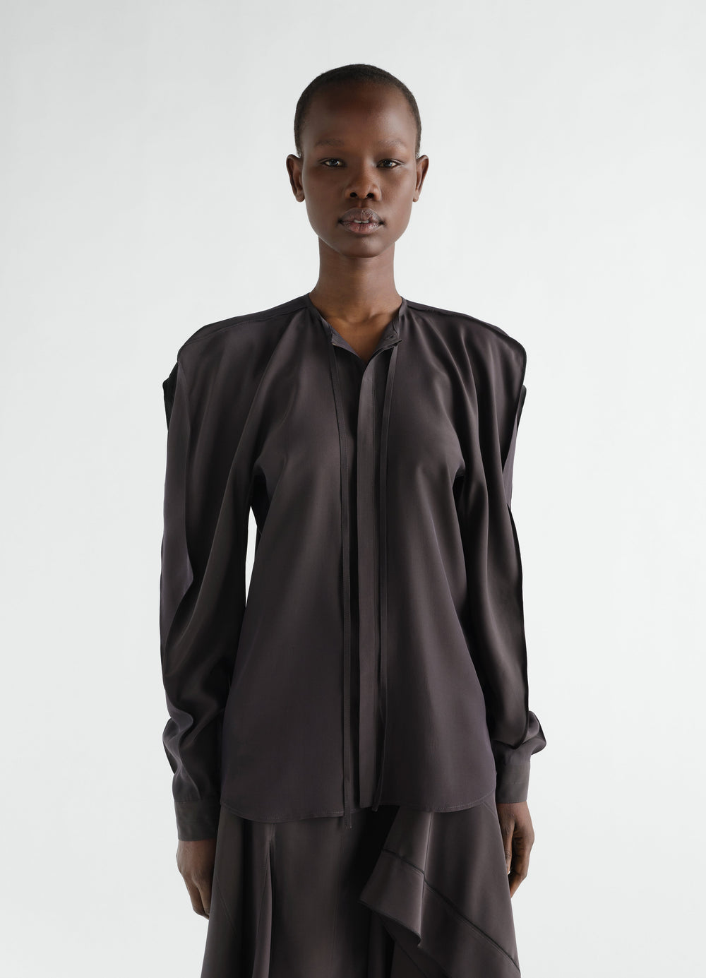 Layered black silk and viscose blouse worn by model front view LEMAIRE