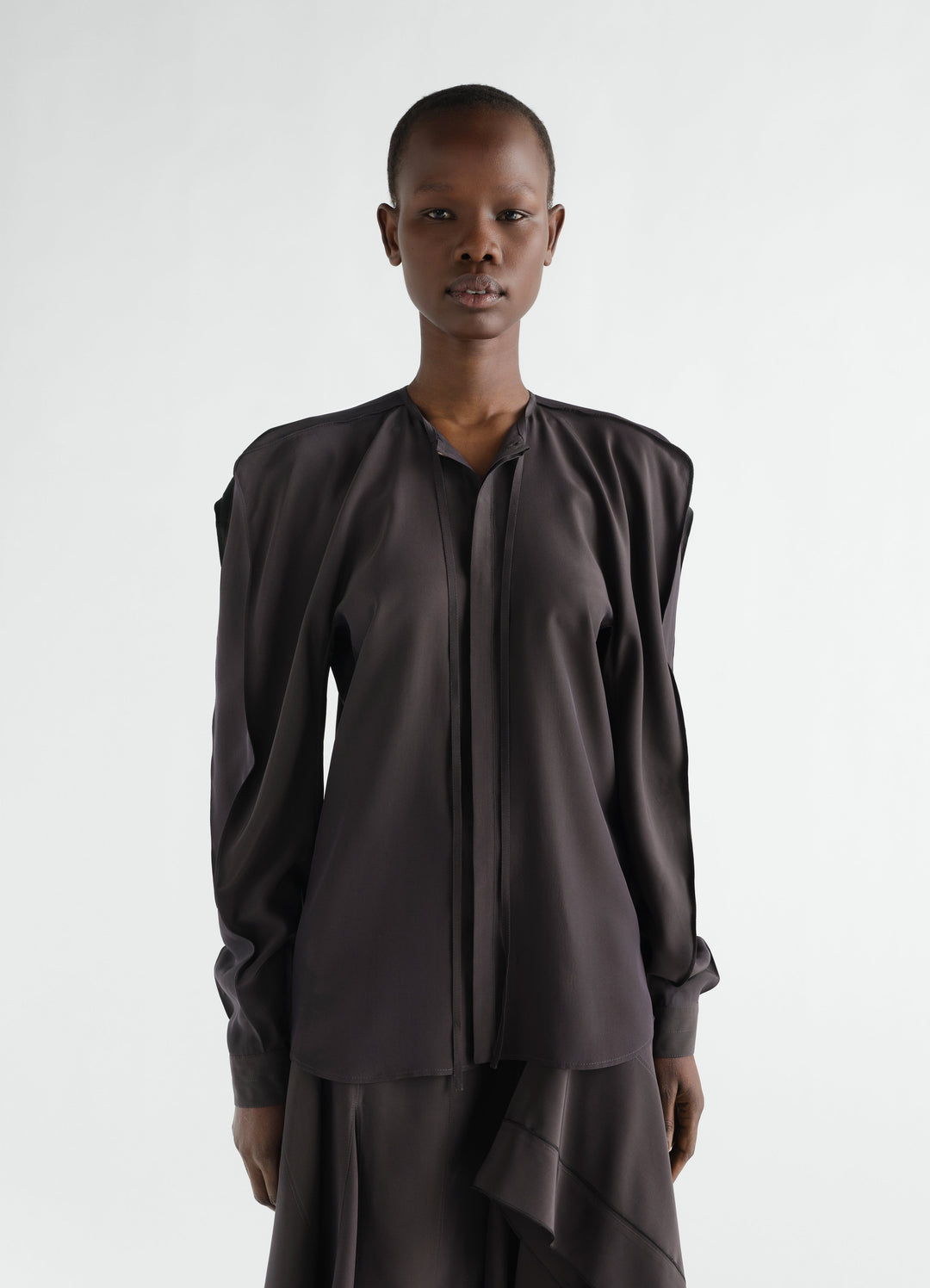 Layered black silk and viscose blouse worn by model front view LEMAIRE