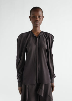 Layered black silk and viscose blouse worn by model front view lemaire
