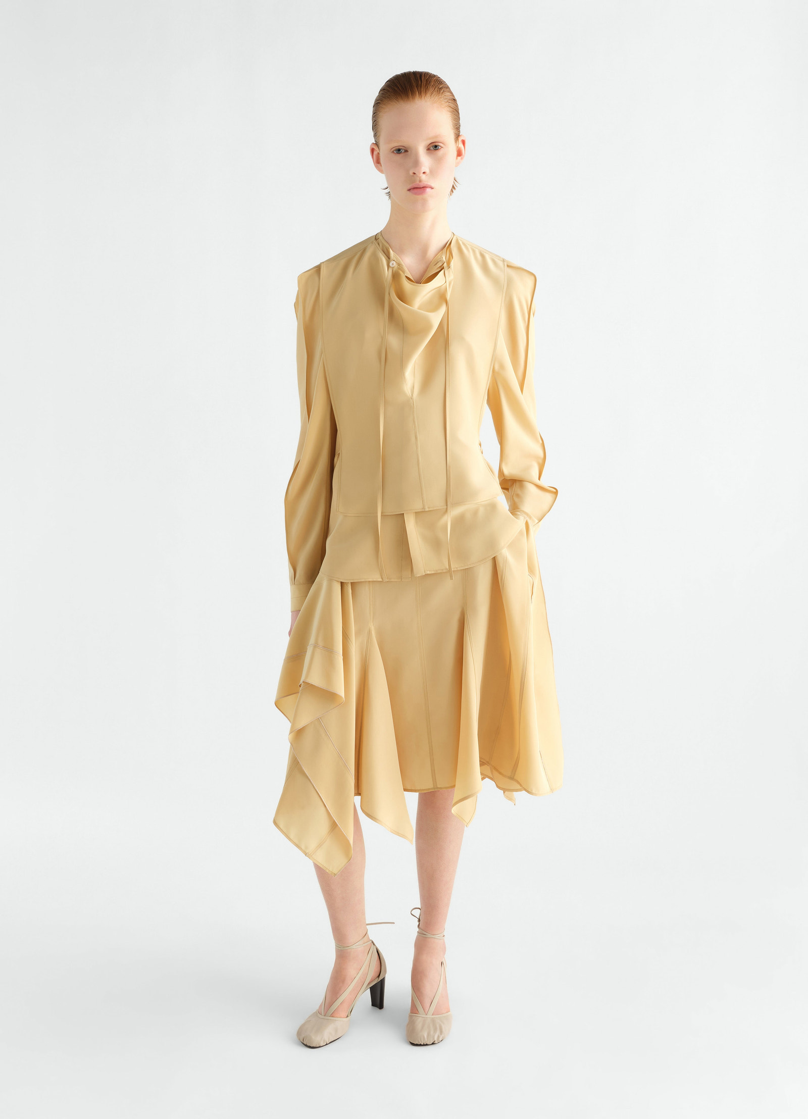 Layered silk and viscose cloth blouse in beige worn by model with asymmetrical skirt lemaire front view