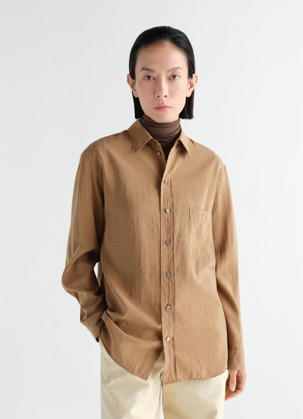 Straight shirt in camel dry silk worn by model with brown turtleneck LEMAIRE front view