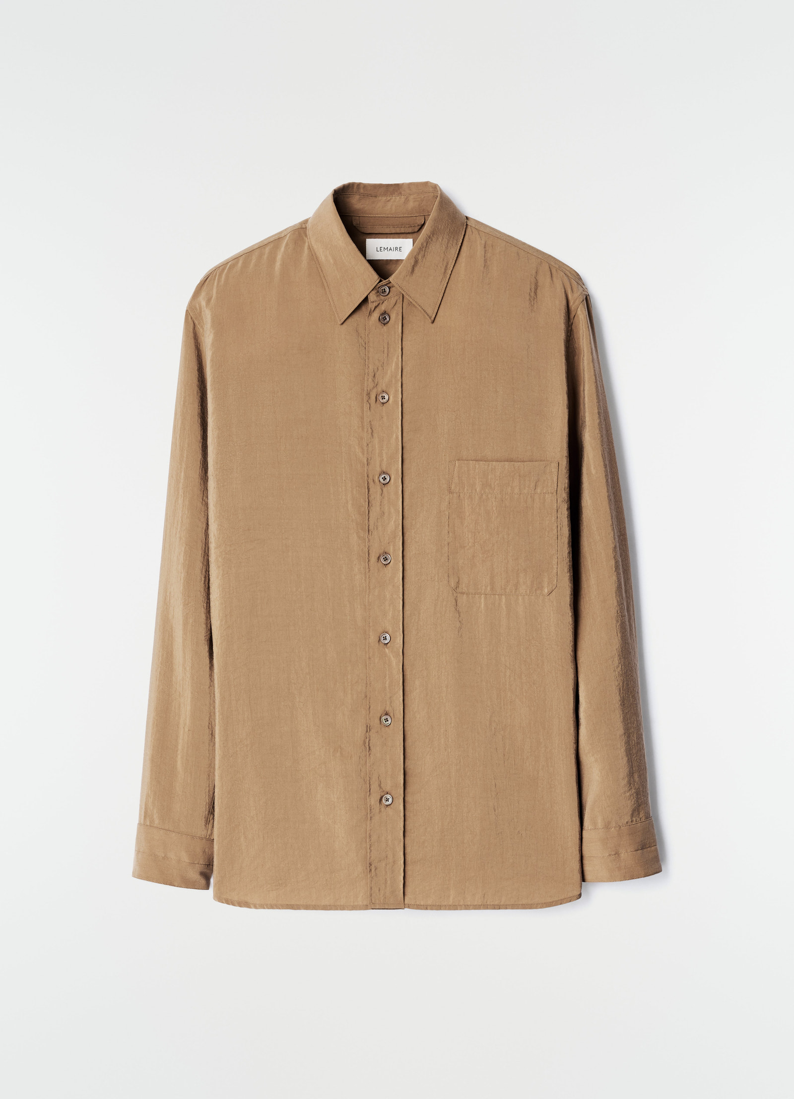 Straight beige dry silk shirt with chest pocket lemaire front view on plain white background