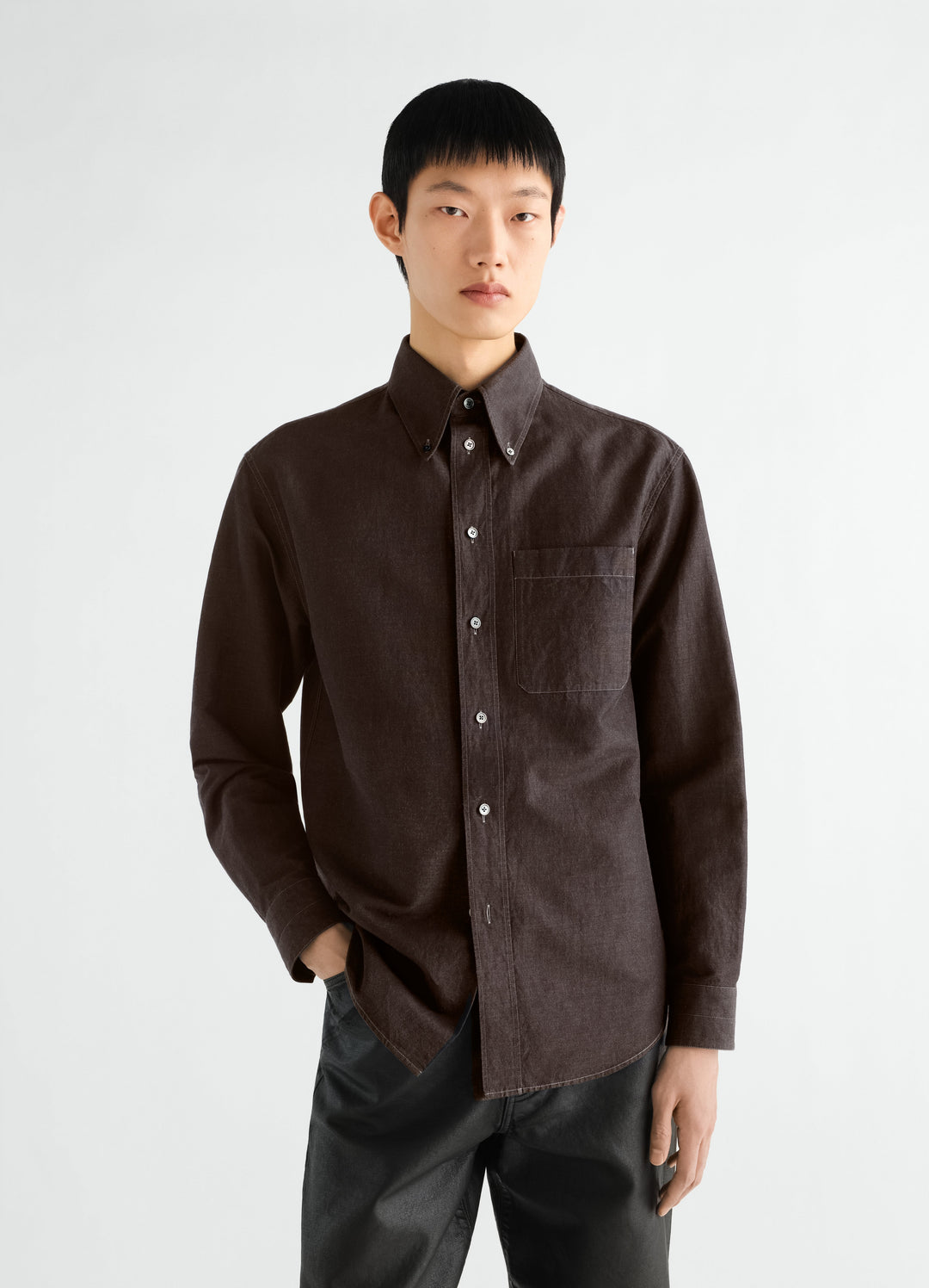 Button-down shirt in dark brown linen cotton chambray worn by model front view LEMAIRE