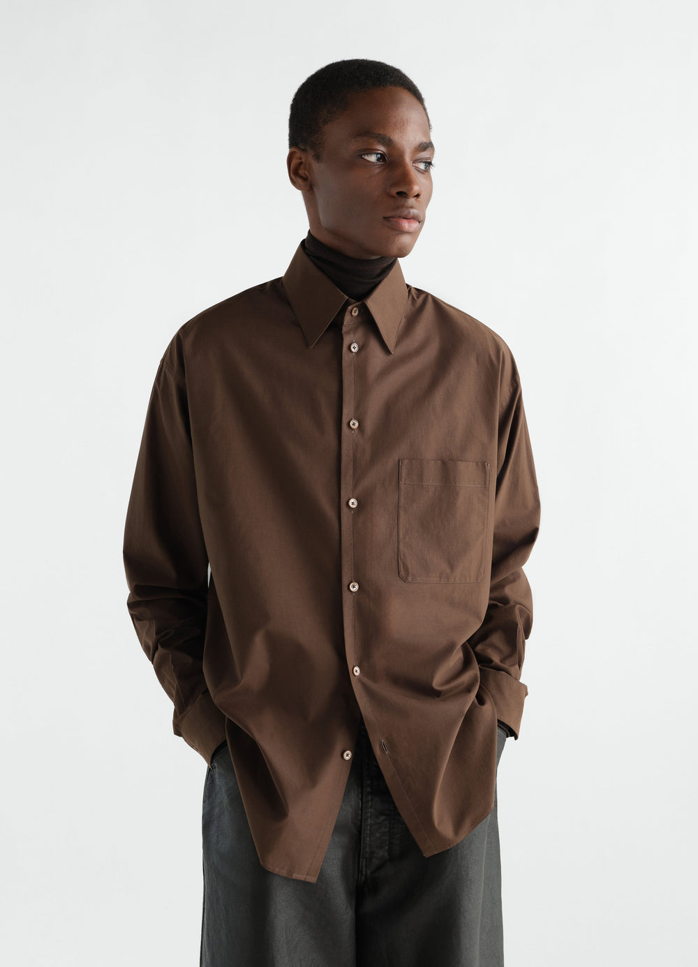 Regular brown washed cotton silk shirt LEMAIRE worn by a model front view with black turtleneck and pants