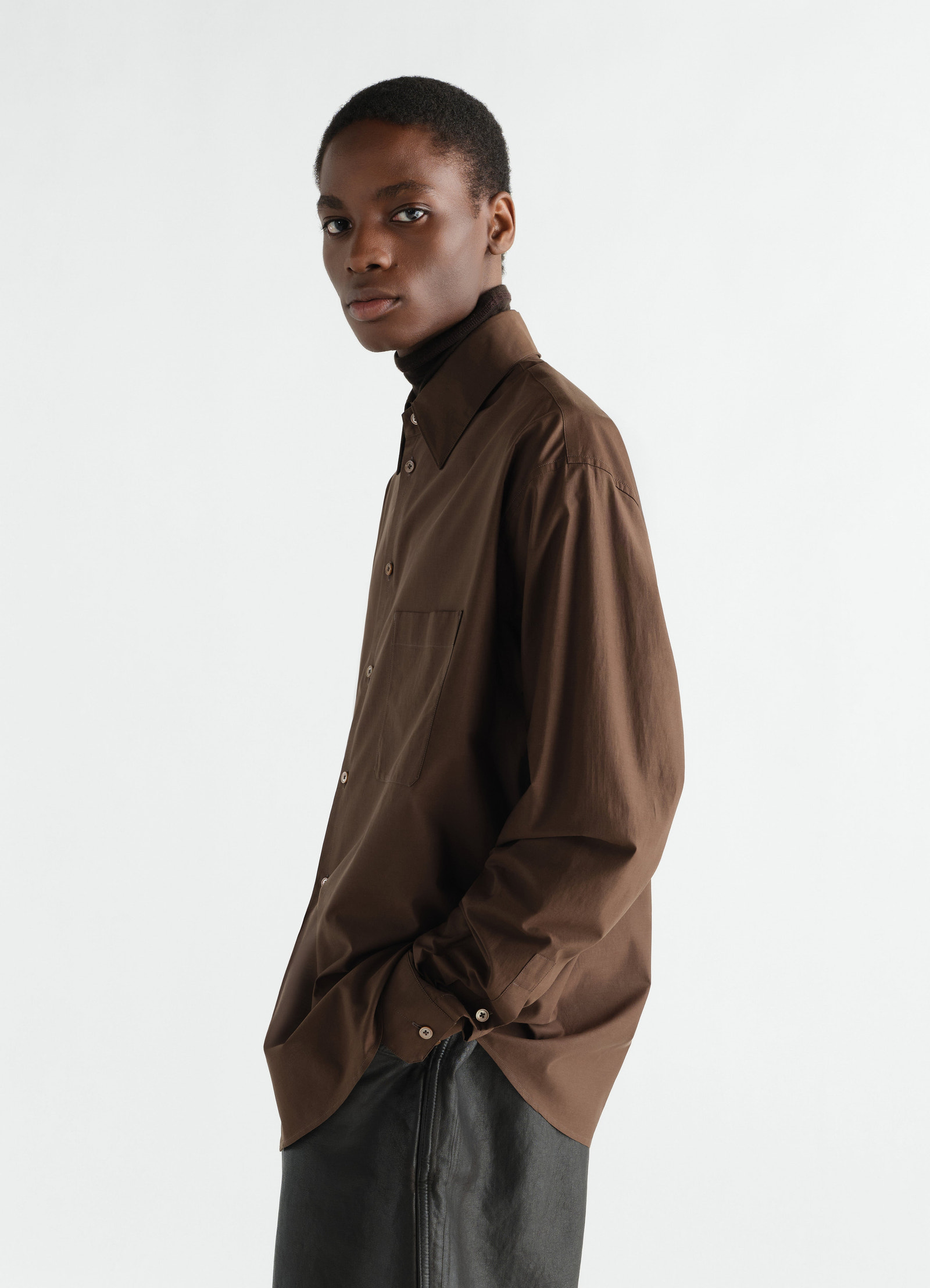 Regular brown washed cotton silk shirt by lemaire worn by model side view with front pocket and button cuffs