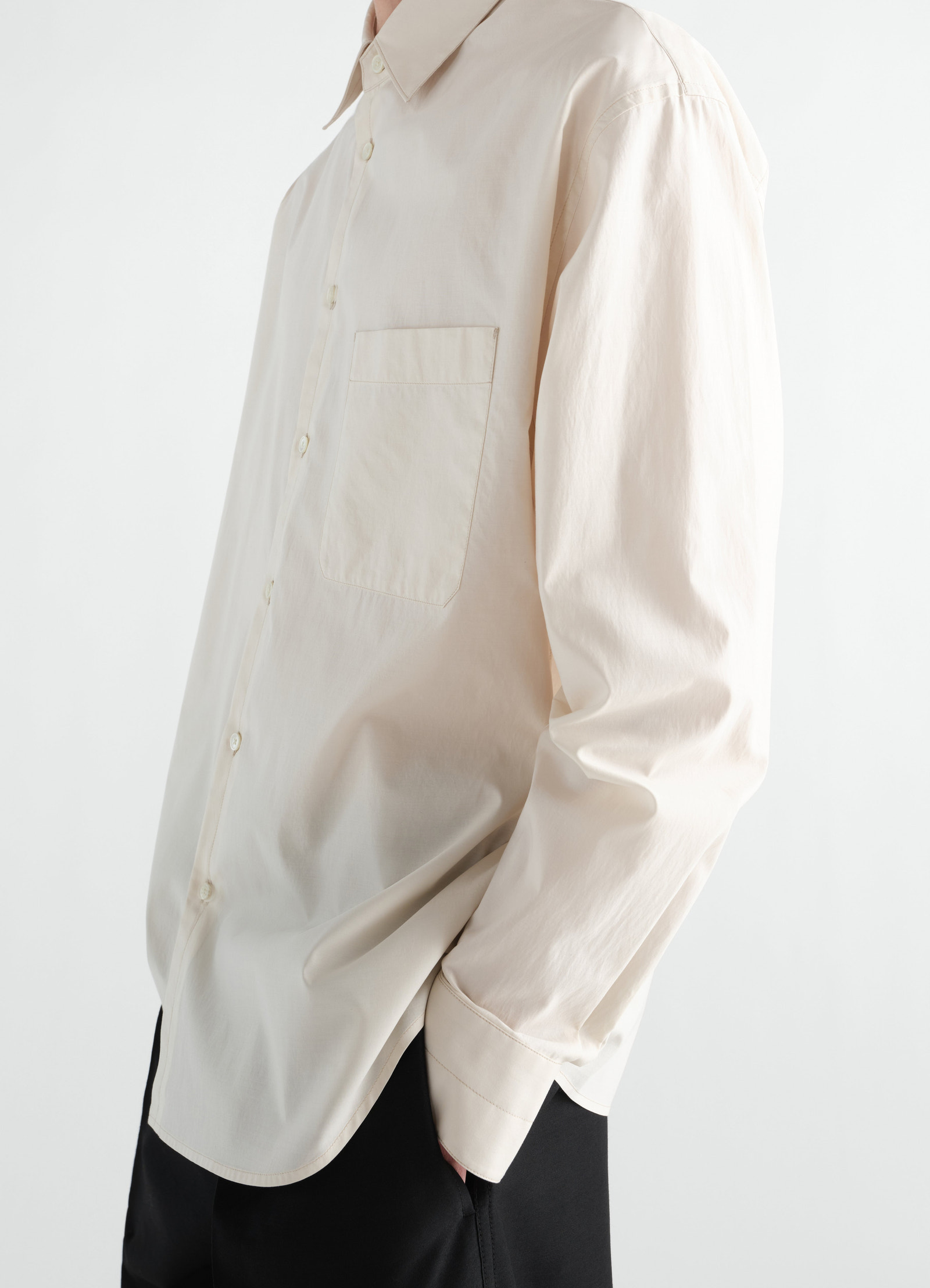 Regular shirt in washed beige cotton silk with chest pocket worn by model lemaire side view