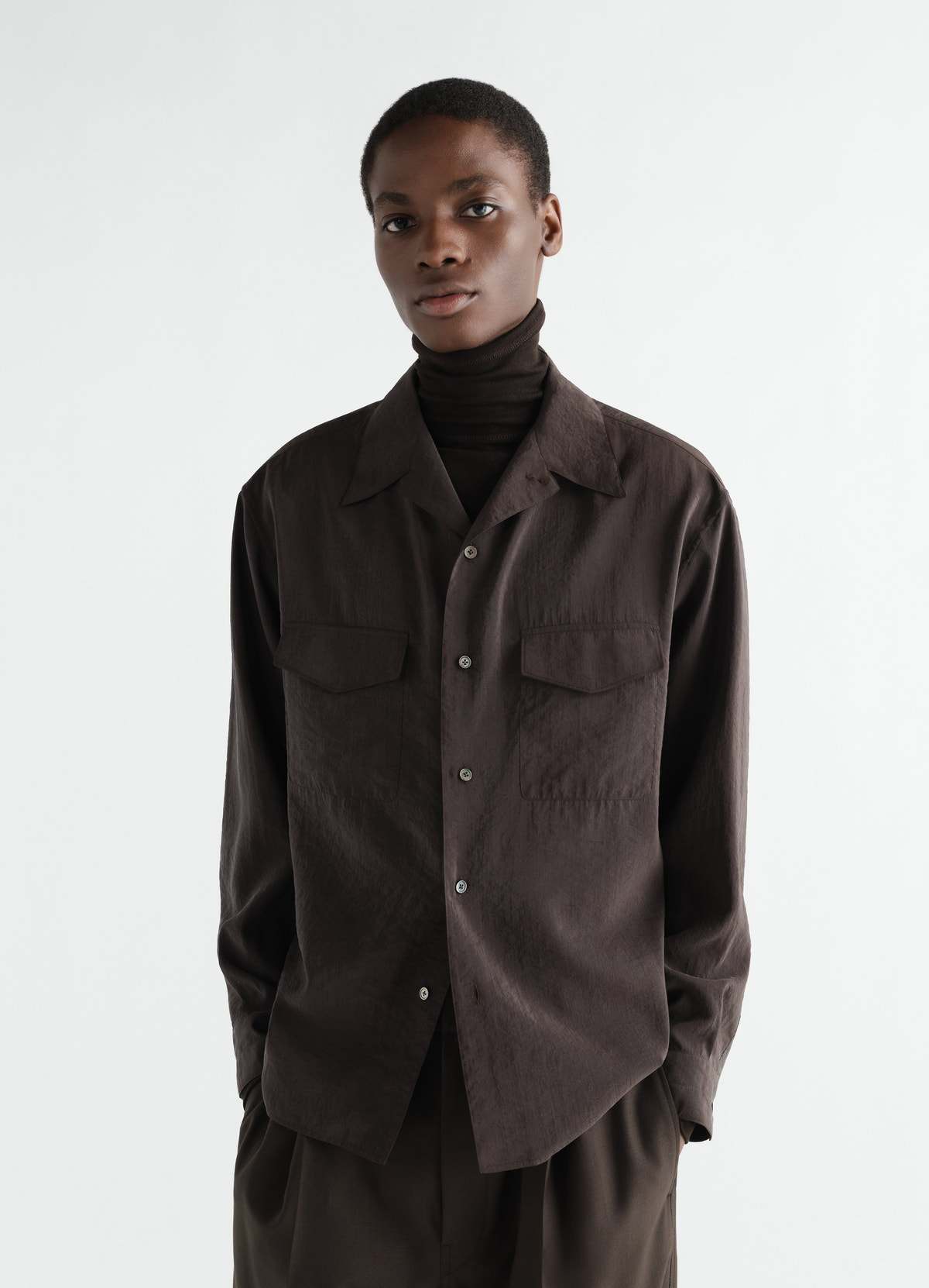 Convertible collar shirt in dark brown dry silk worn by model front lemaire