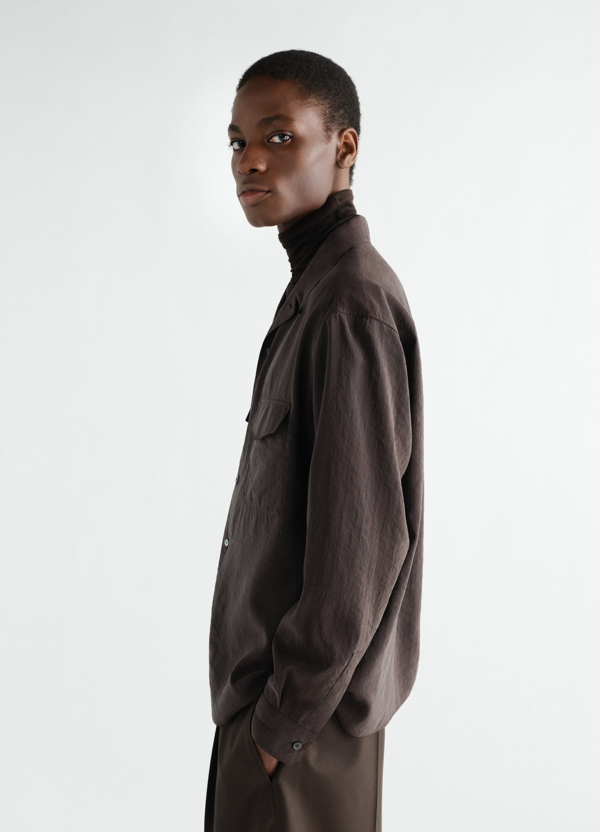 Convertible collar dry silk shirt in dark brown lemaire side view worn by model
