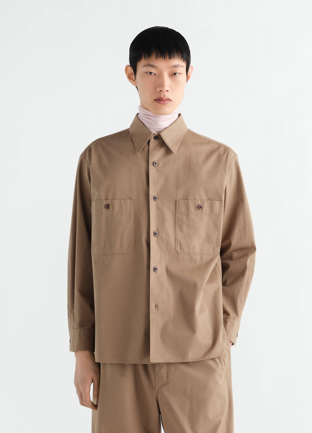 Two-pocket light brown cotton twill shirt LEMAIRE worn by a model front view