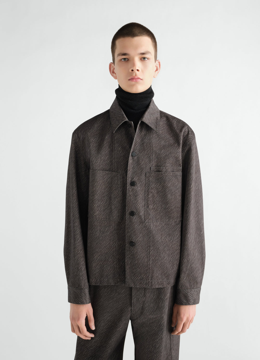 Workwear Overshirt in dark brown diagonal printed cotton worn by a model front view LEMAIRE