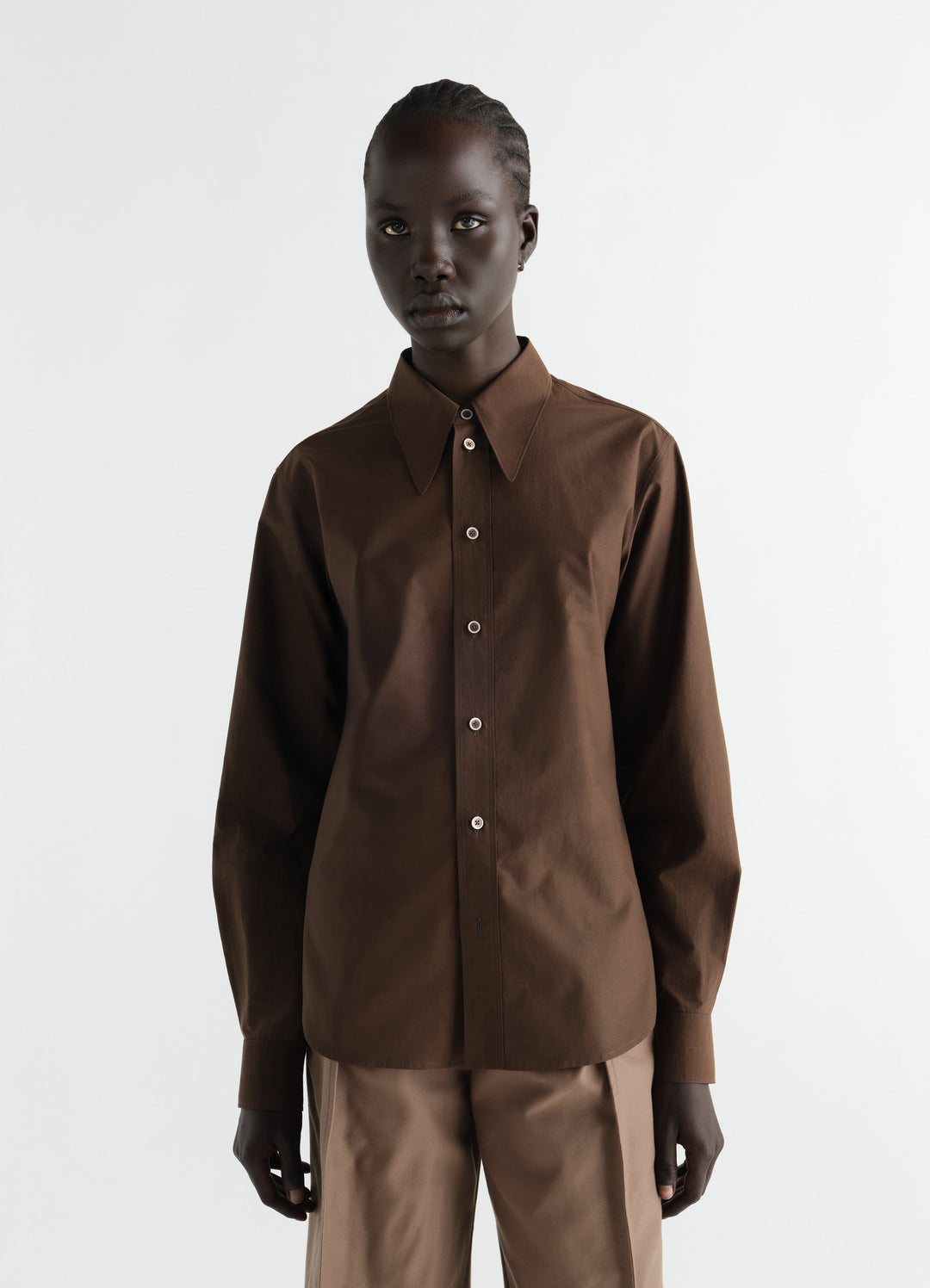 Pointed collar brown cotton silk shirt by LEMAIRE worn by model front view