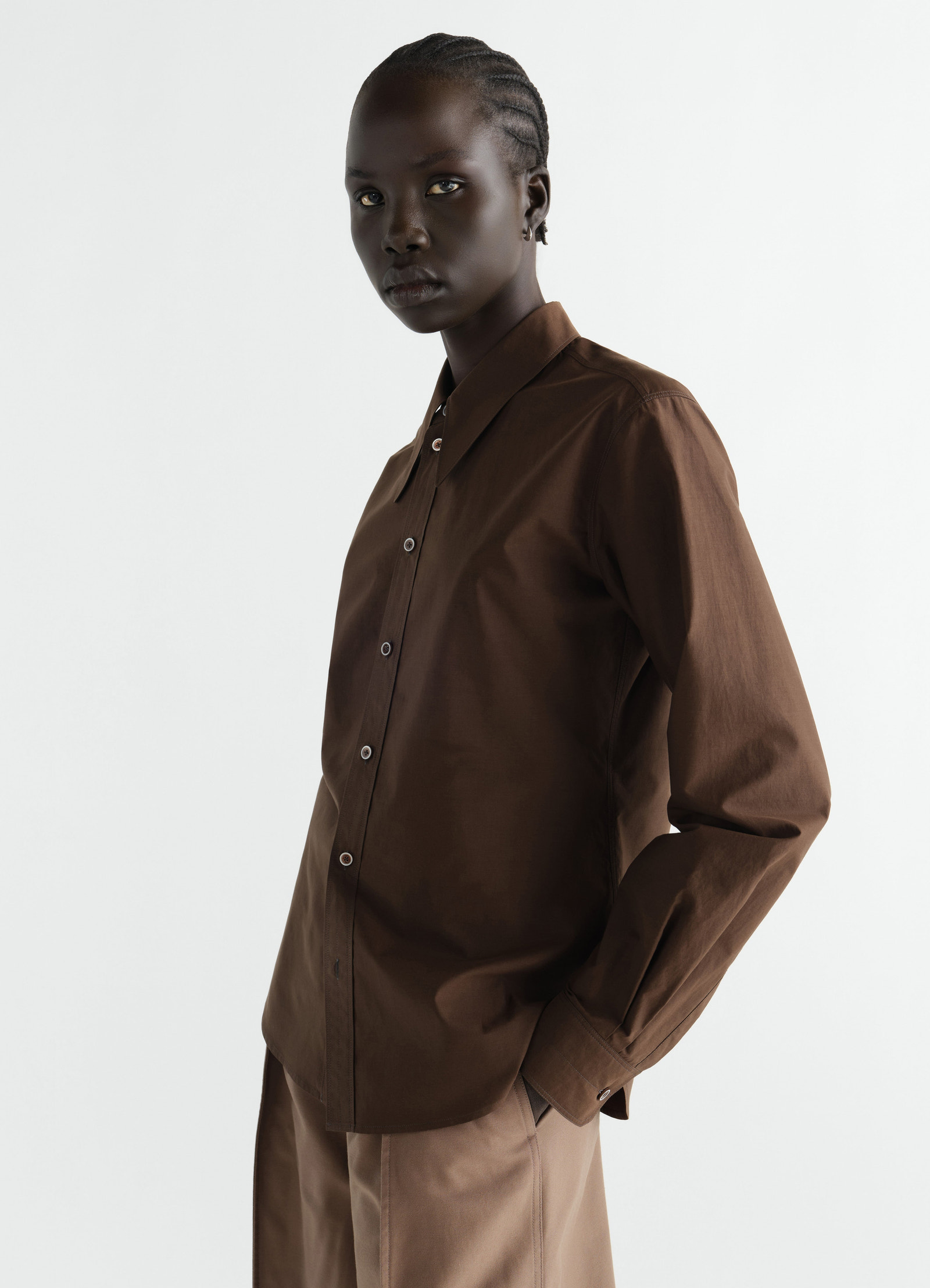 Pointed collar shirt in brown washed cotton silk worn by model side view lemaire