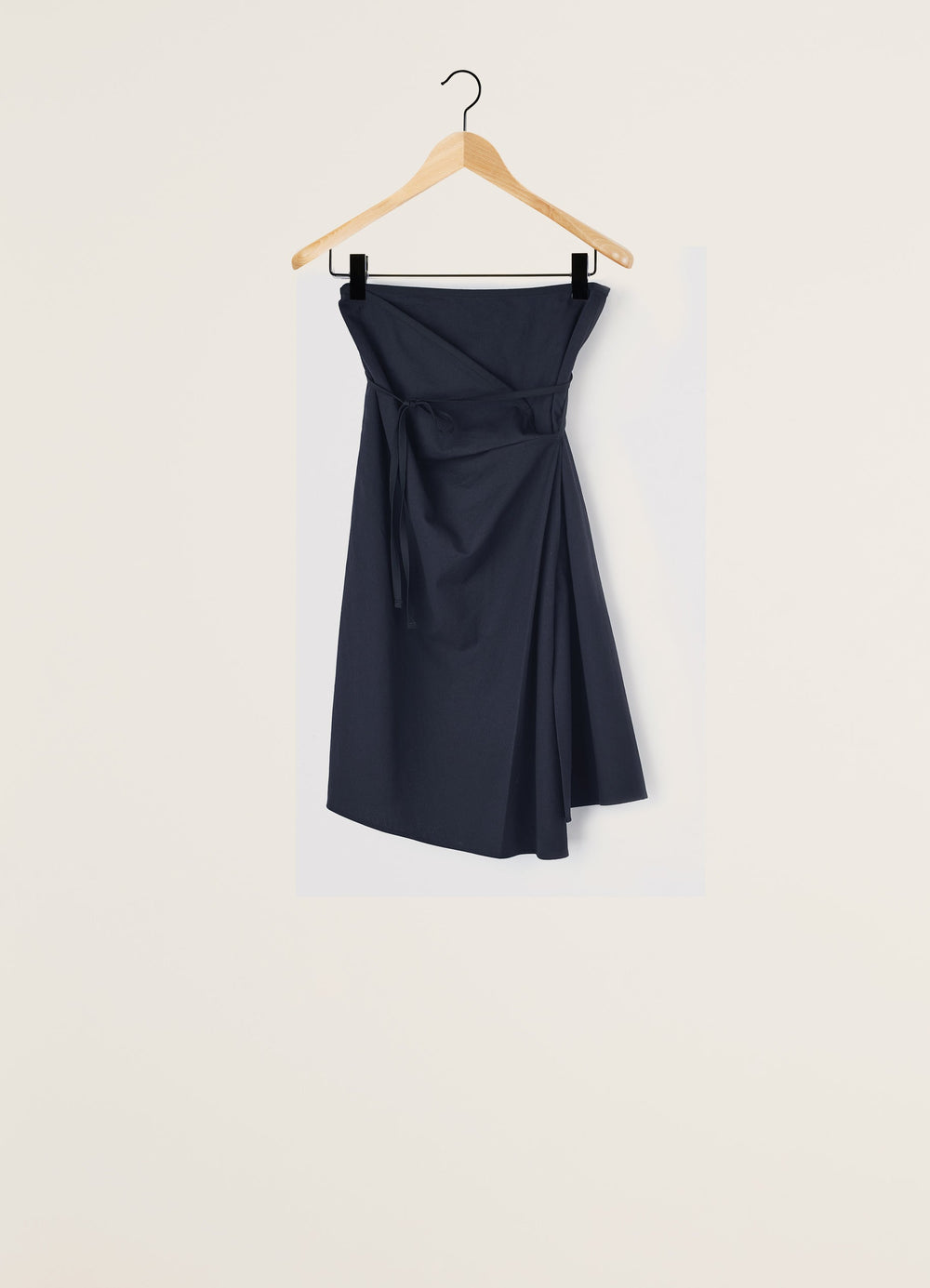 Lemaire Asymmetrical Tied Skirt in Dark Navy Cotton Twill, product shot, Front view hanging Asymmetrical draped design