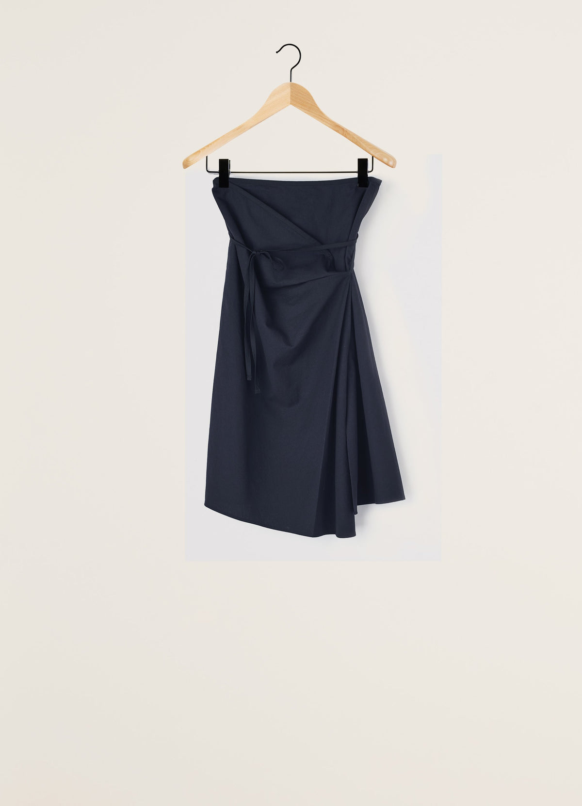 Lemaire Asymmetrical Tied Skirt in Dark Navy Cotton Twill, product shot, Front view hanging Asymmetrical draped design