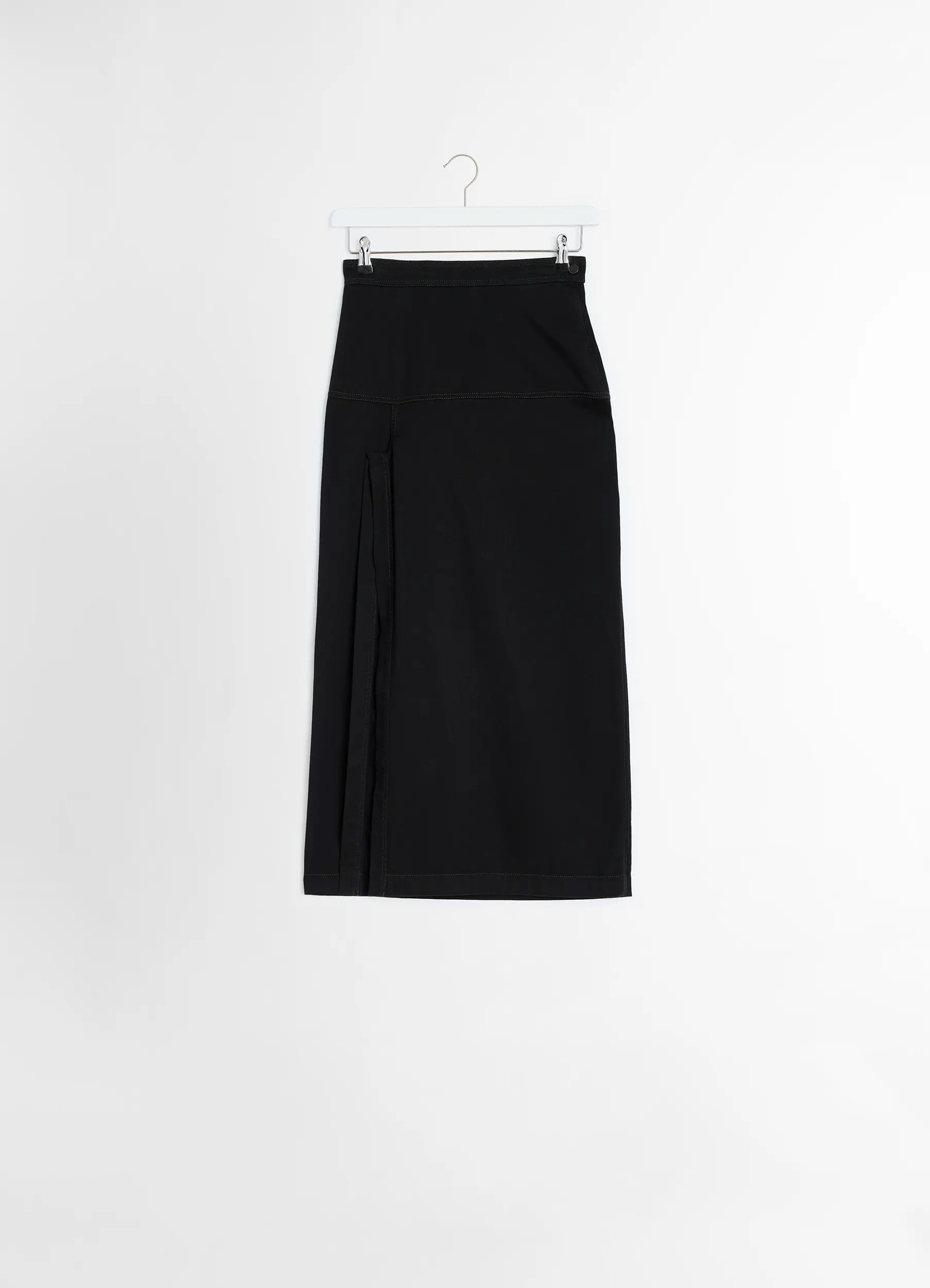 Lemaire asymmetrical wrap skirt in black cotton denim, product shot, hanging view asymmetrical pleated detail