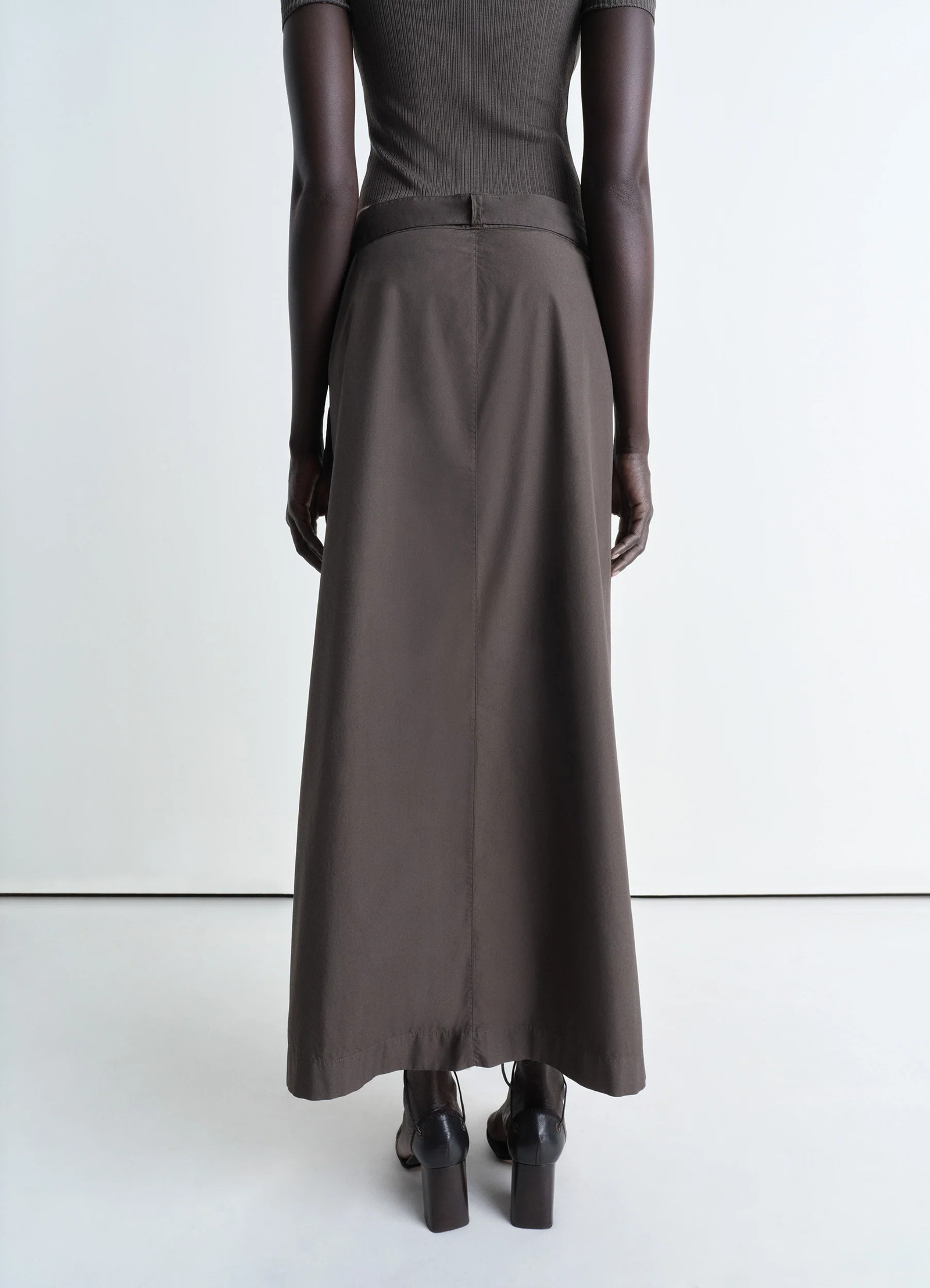 Lemaire buttoned long skirt in garment dyed cotton poplin, model shot, back view flowing a-line cut