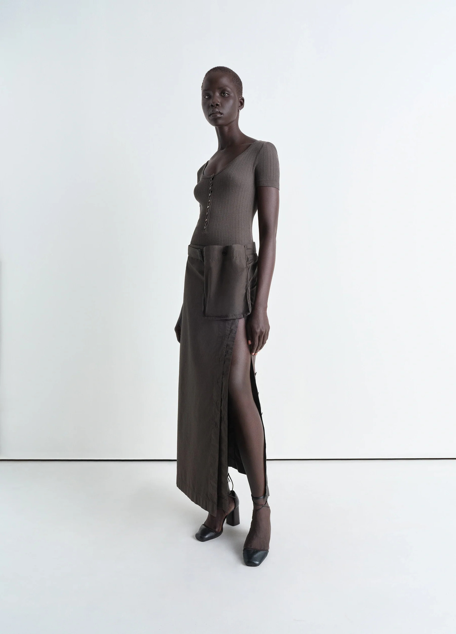 Lemaire buttoned long skirt in garment dyed cotton poplin, model shot, side view high slit with pocket