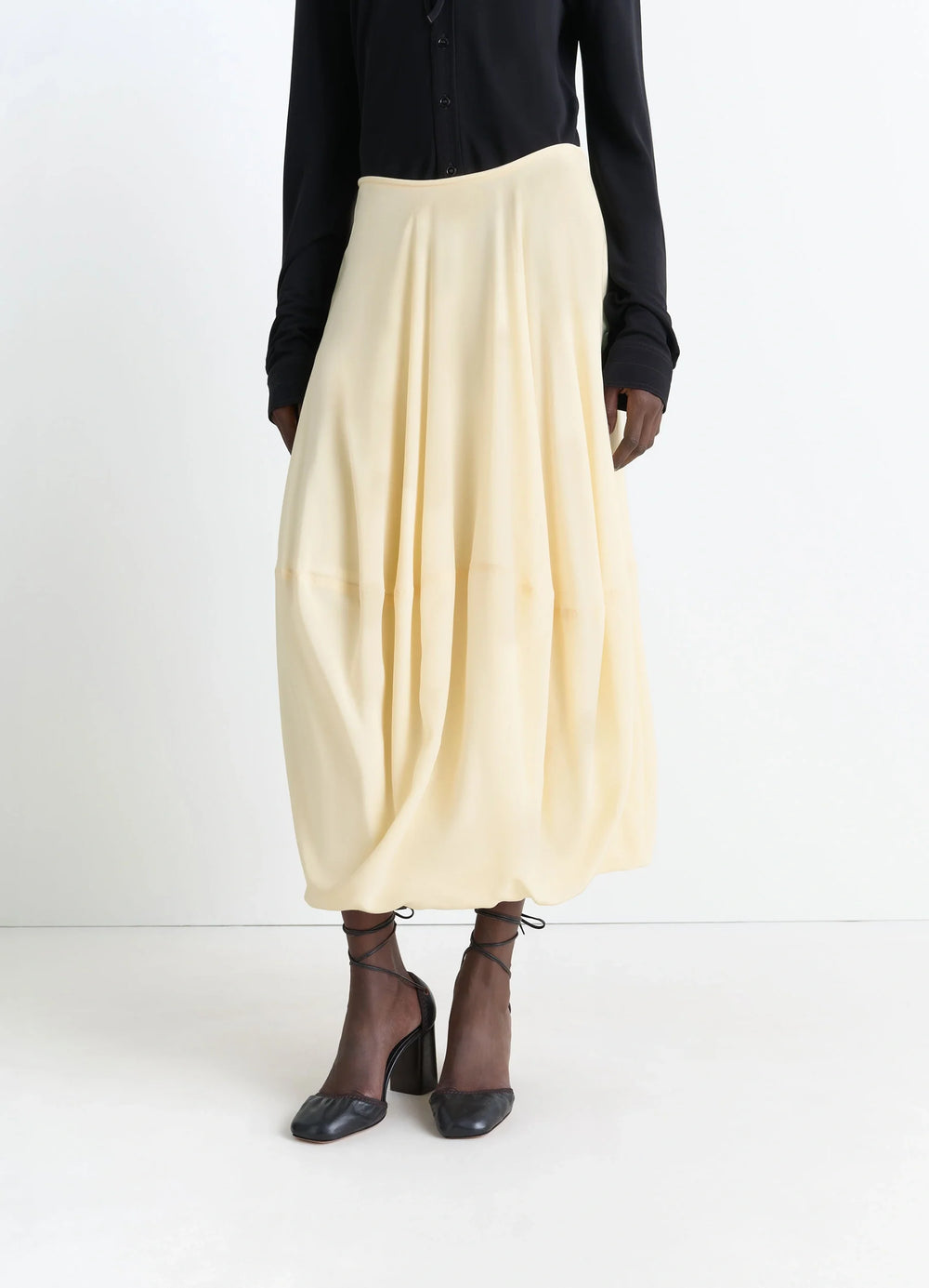 Balloon Skirt in Silk Crepe de Chine, model shot, side view pleated hem detail