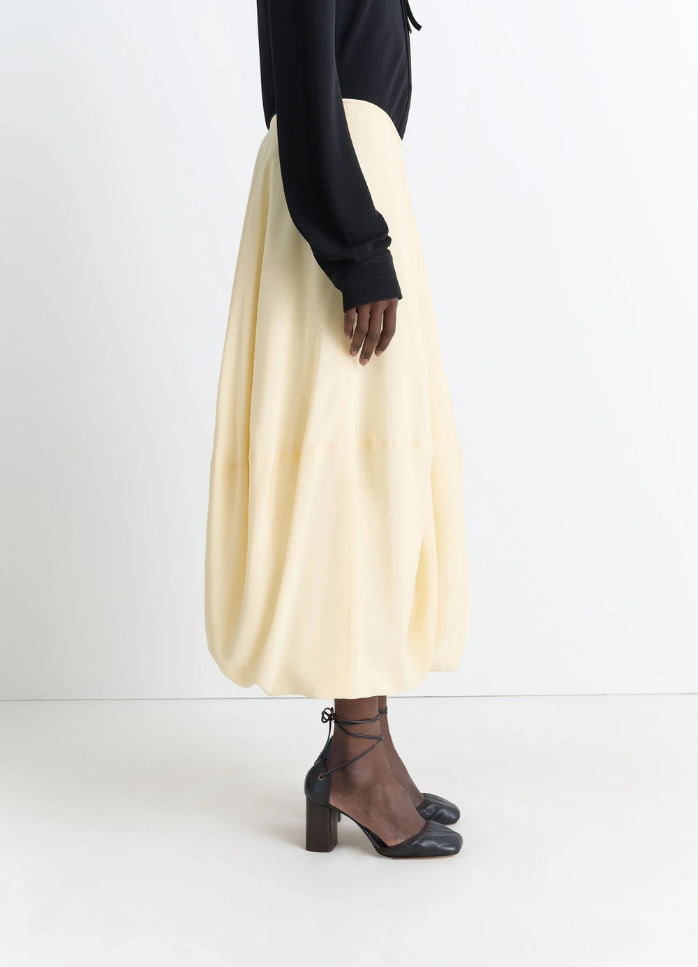 Balloon Skirt in Silk Crepe de Chine, model shot, three-quarter view balloon shape side slit