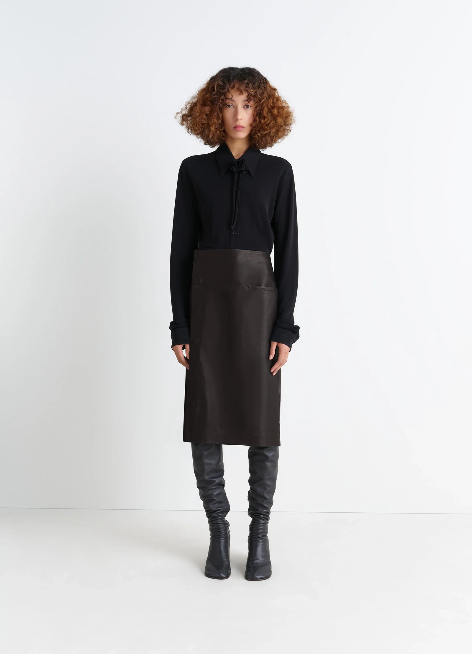 Lemaire leather wrapover skirt in supple cow leather, model shot, front view wrapover with snap closure